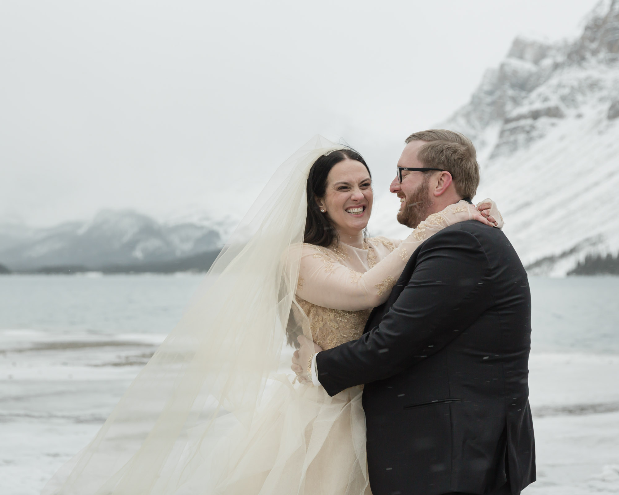 Wedding couple posing at Bow Lake in Banff National Park during their Elopement