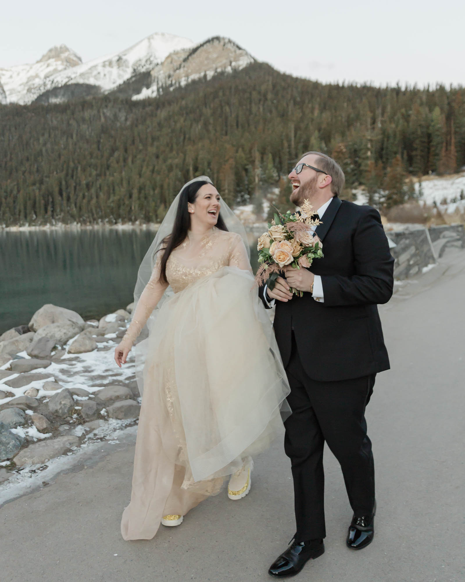 Banff National Park wedding, the couple is walking and laughing