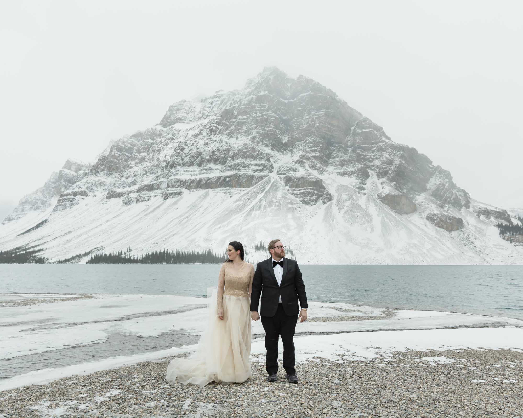 Wedding couple posing at Bow Lake in Banff National Park during their Elopement