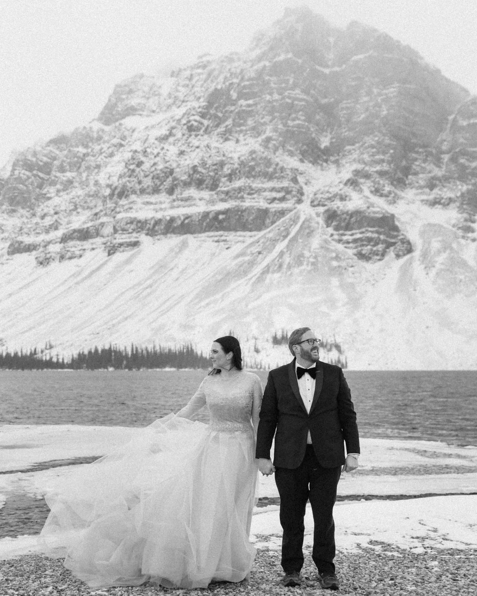 Wedding couple posing at Bow Lake in Banff National Park during their Elopement