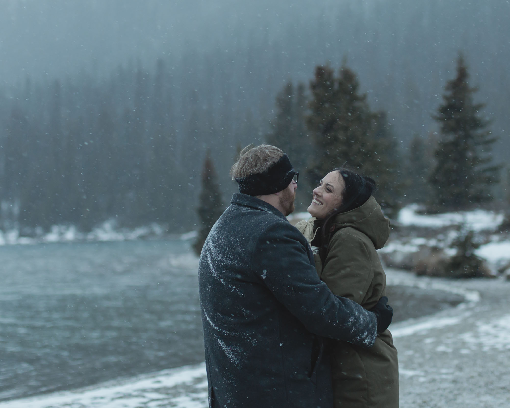 Wedding couple having their first dance at Bow Lake in Banff National Park during their Elopement in the winter at sunset