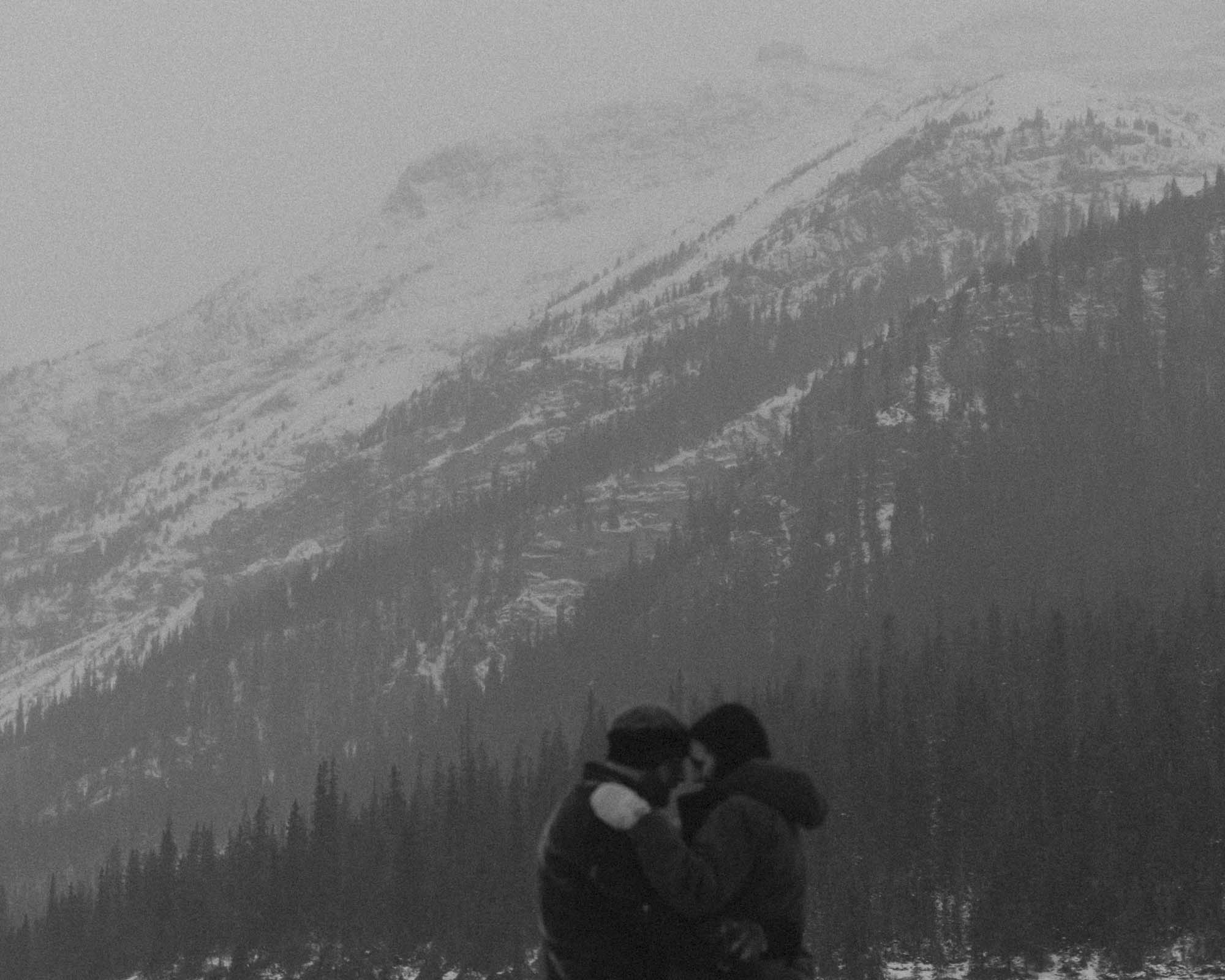 Wedding couple having their first dance at Bow Lake in Banff National Park during their Elopement in the winter at sunset