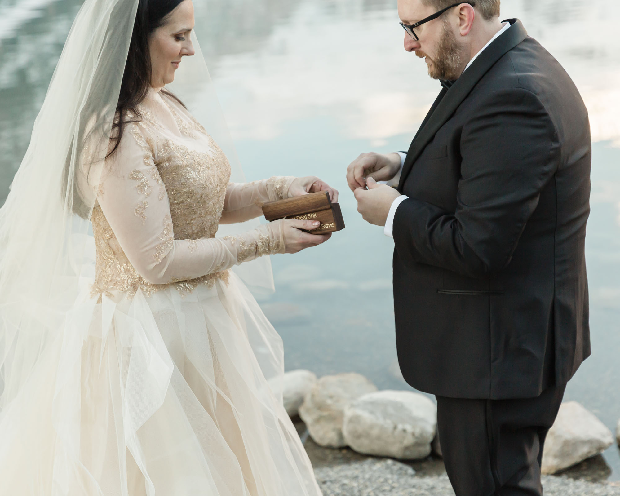 A Lake louise elopement, the couple is about to exchange their wedding rings