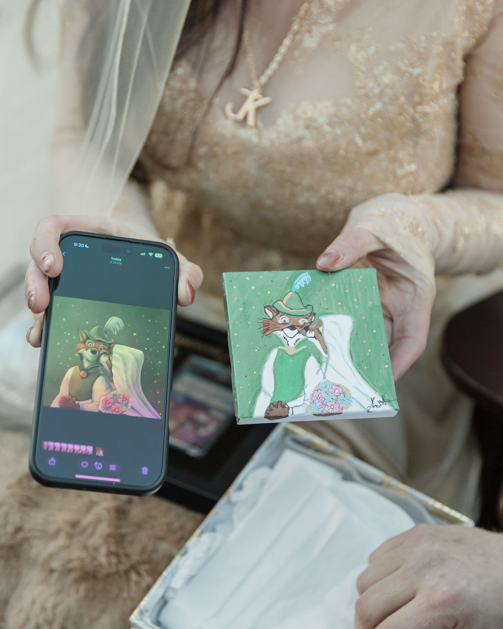 A couple is exchanging gifts and enjoying a bonfire in front of the Fairmont Chateau Lake Louise after their wedding ceremony at sunrise