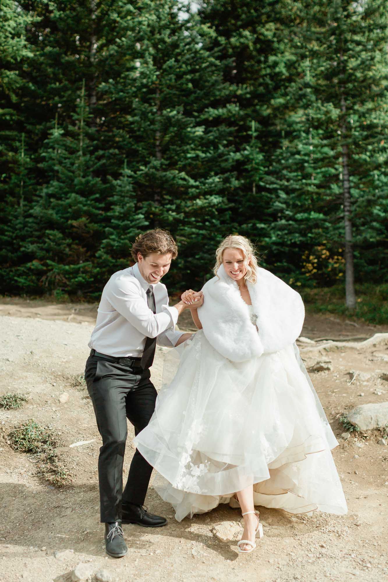 Tyler helping Sarah in her wedding shoes
