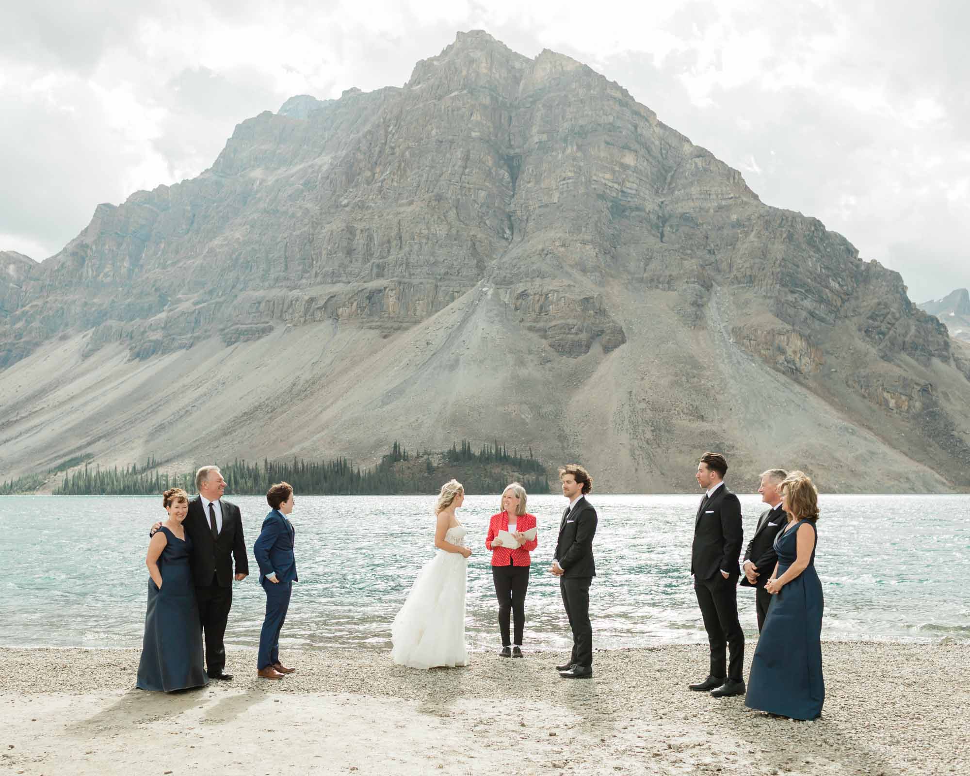 tyler and sarah exchanging vows at bow lake for their summer banff elopement 