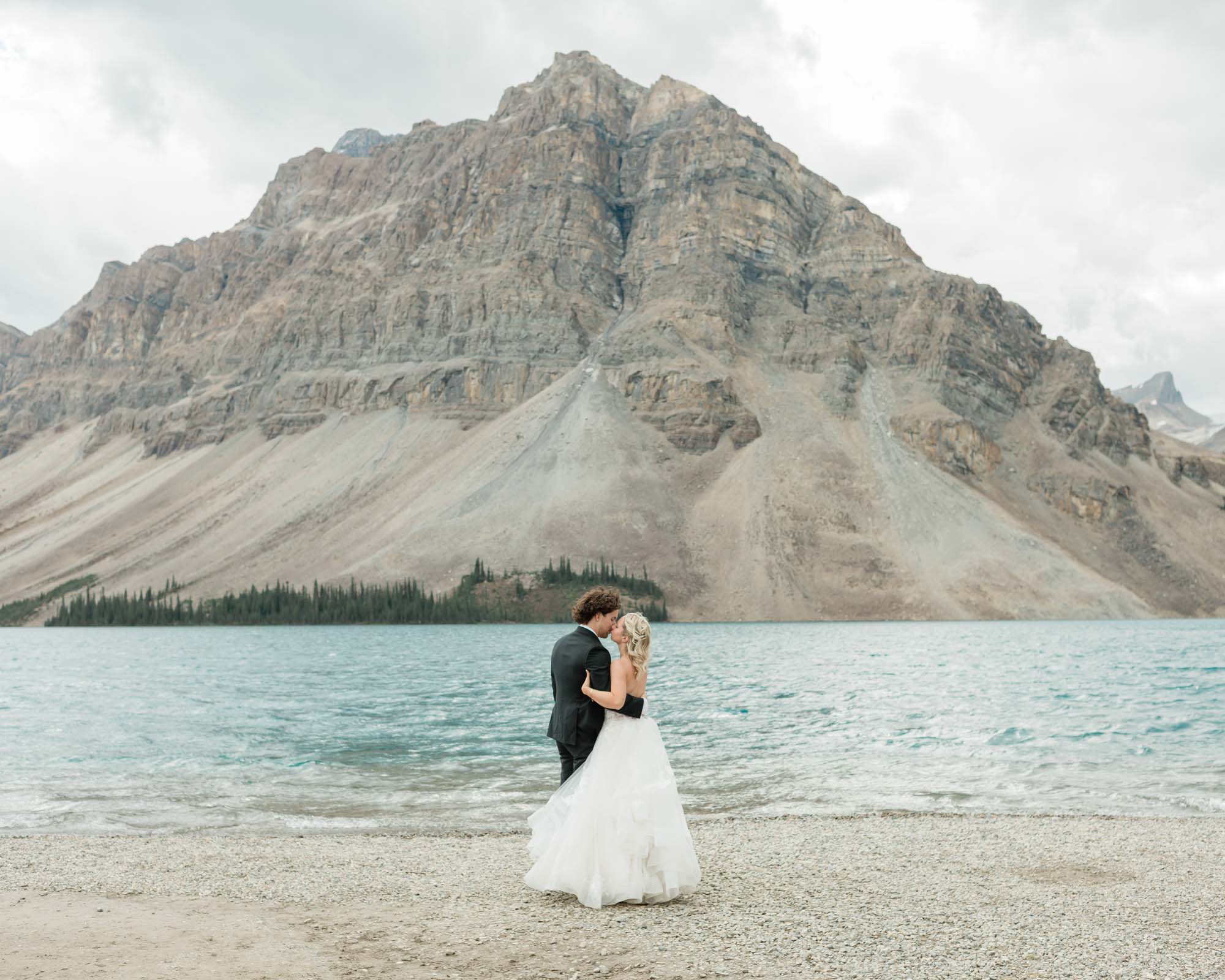 sarah and tyler have their first dance at bow lake during their summer banff elopement