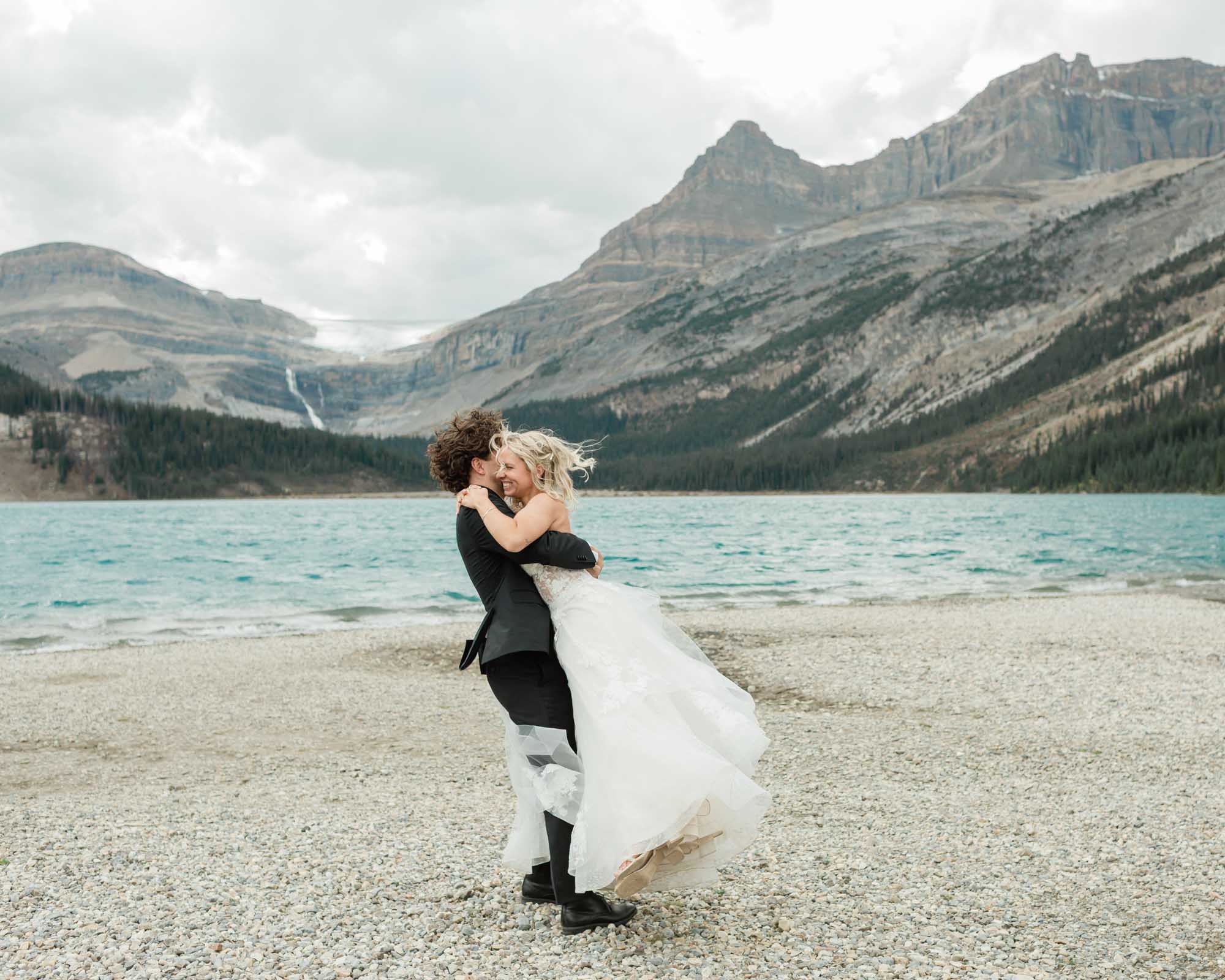 sarah and tyler have their first dance at bow lake during their summer banff elopement