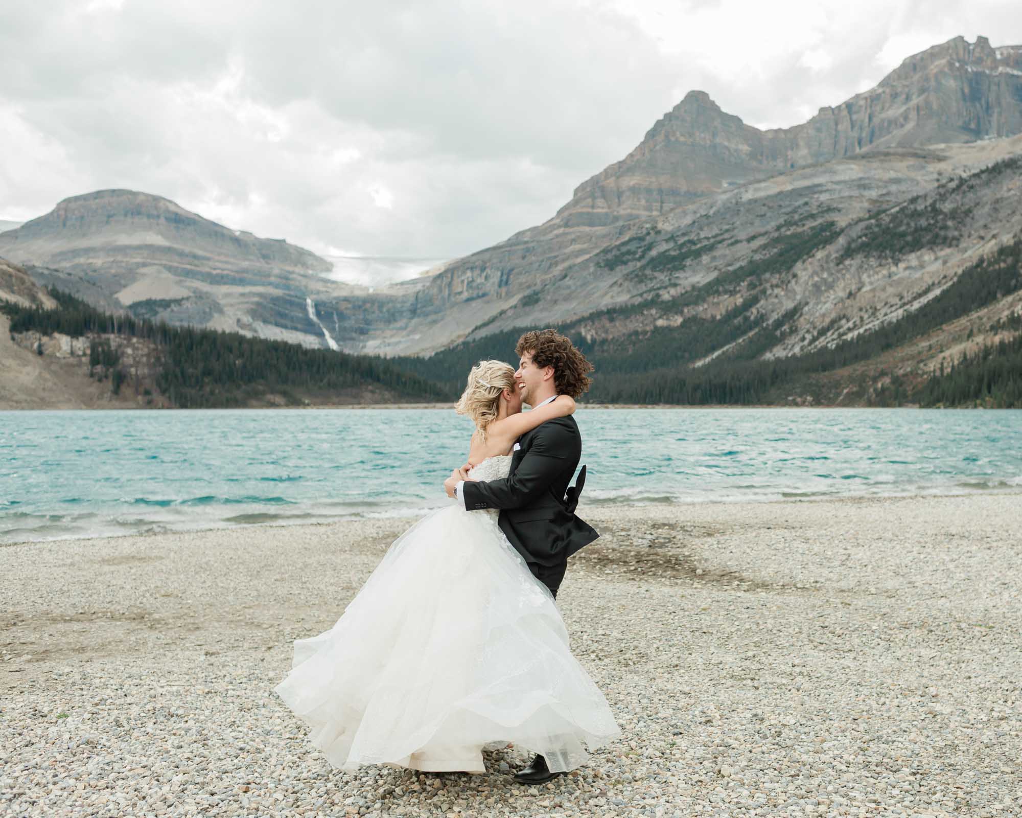 sarah and tyler have their first dance at bow lake during their summer banff elopement