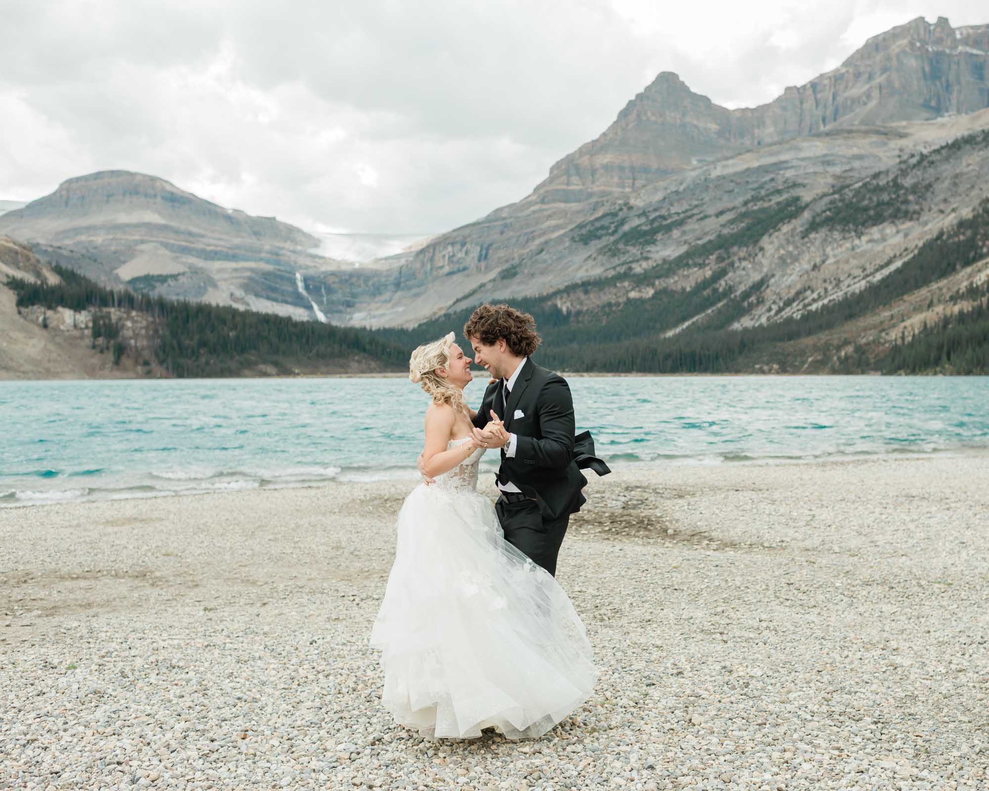 sarah and tyler have their first dance at bow lake during their summer banff elopement