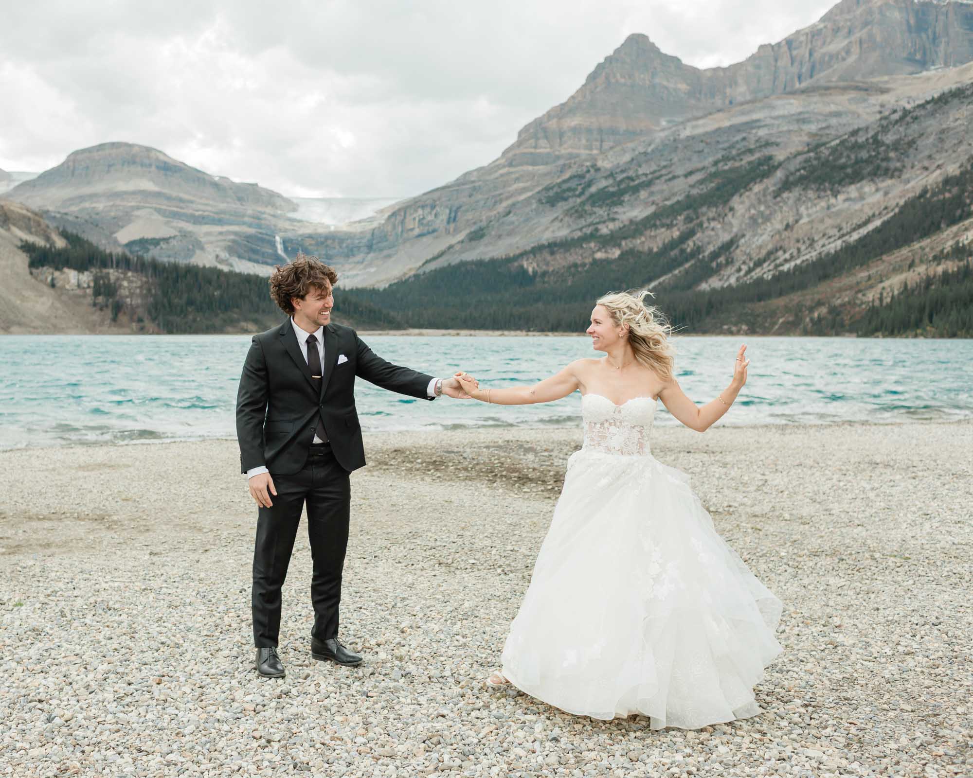 sarah and tyler have their first dance at bow lake during their summer banff elopement