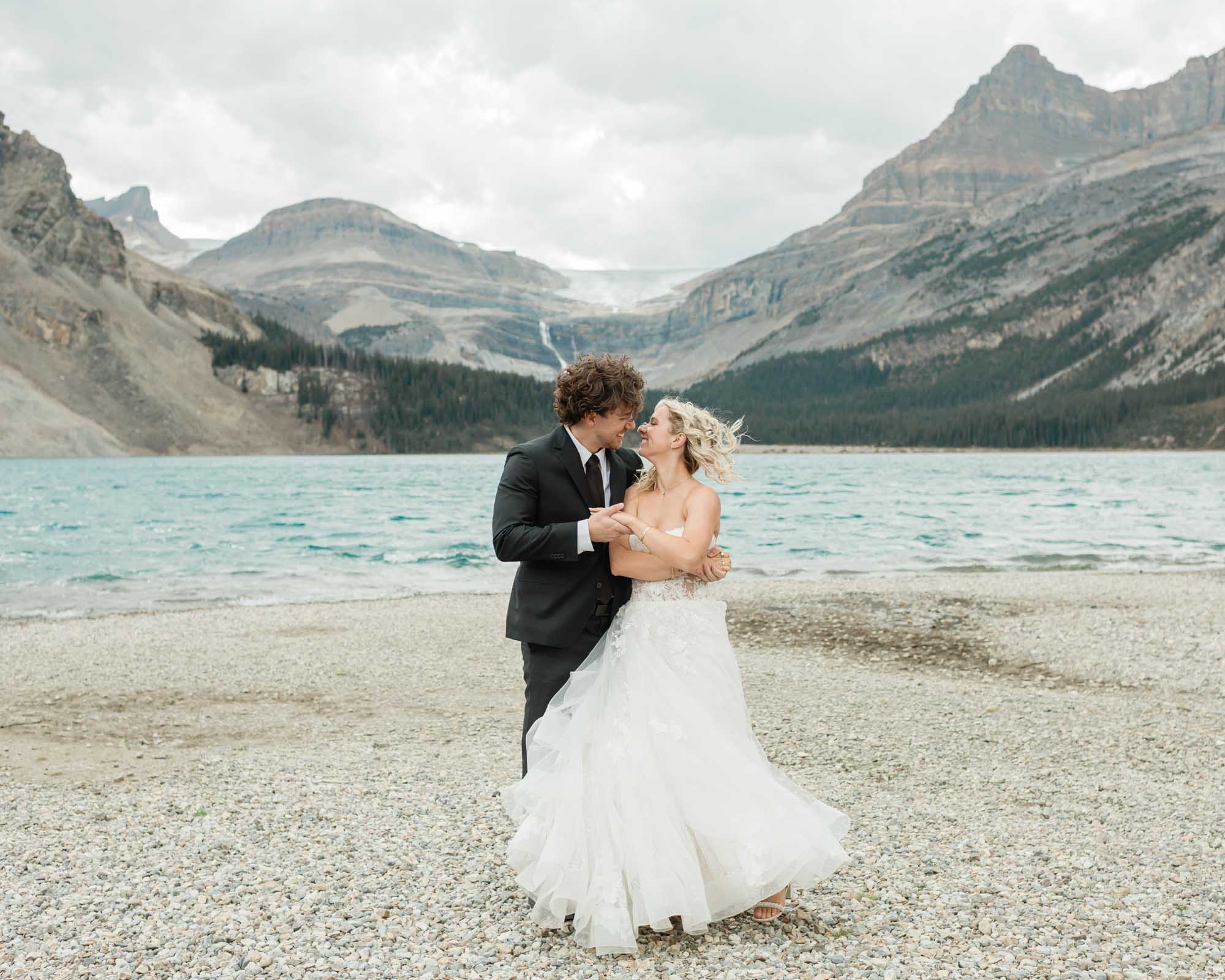 sarah and tyler have their first dance at bow lake during their summer banff elopement