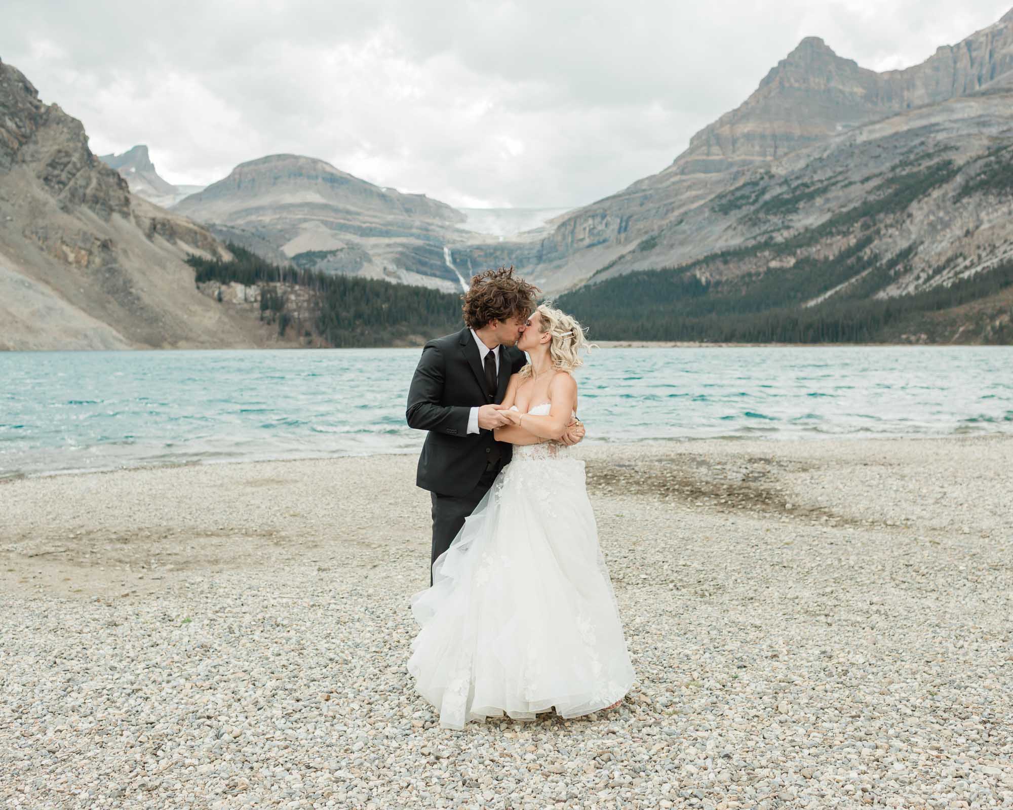 sarah and tyler have their first dance at bow lake during their summer banff elopement