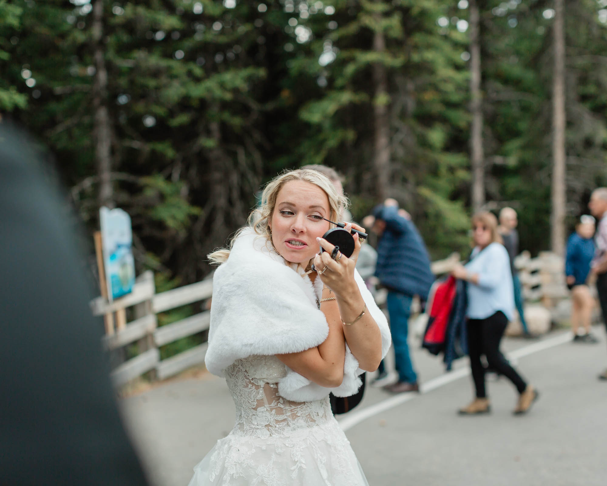 sarah touching up her bridal makeup