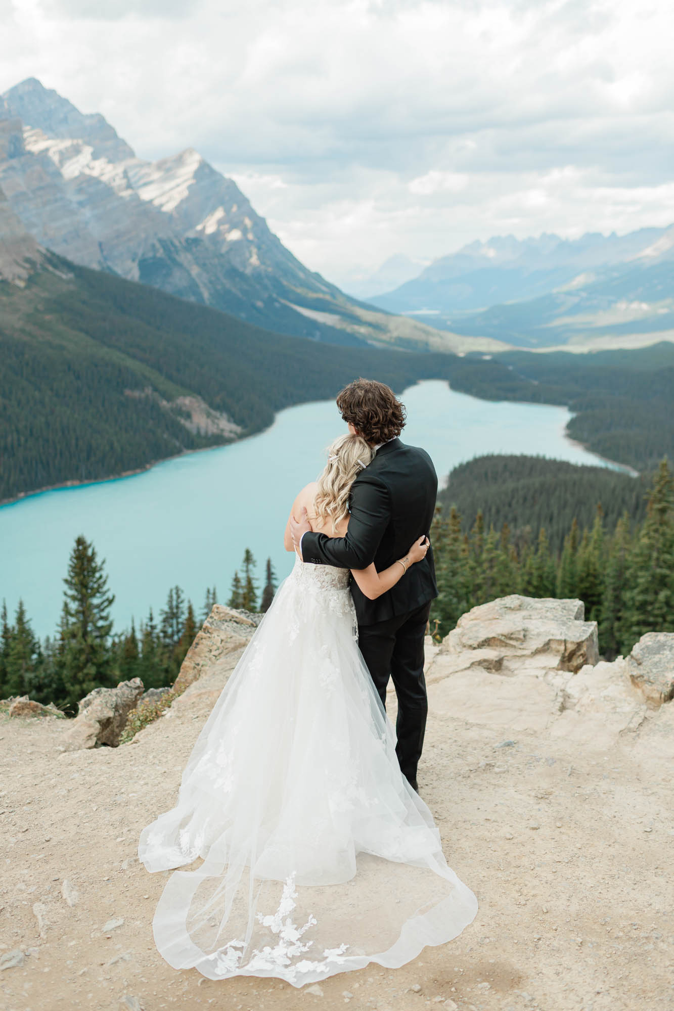 the happy couple looking out at the view 