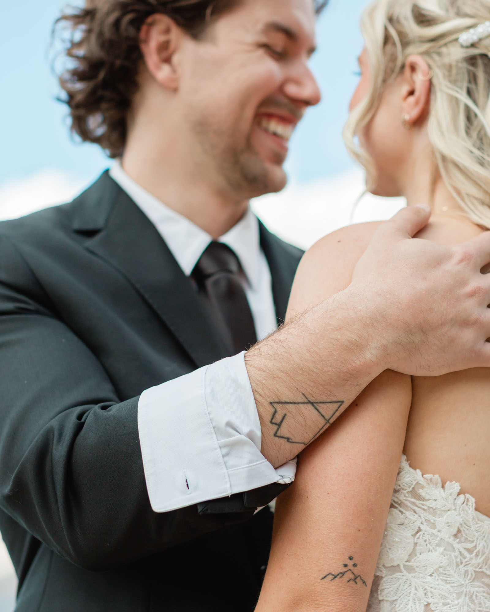 couple tattoos for their wedding in focus