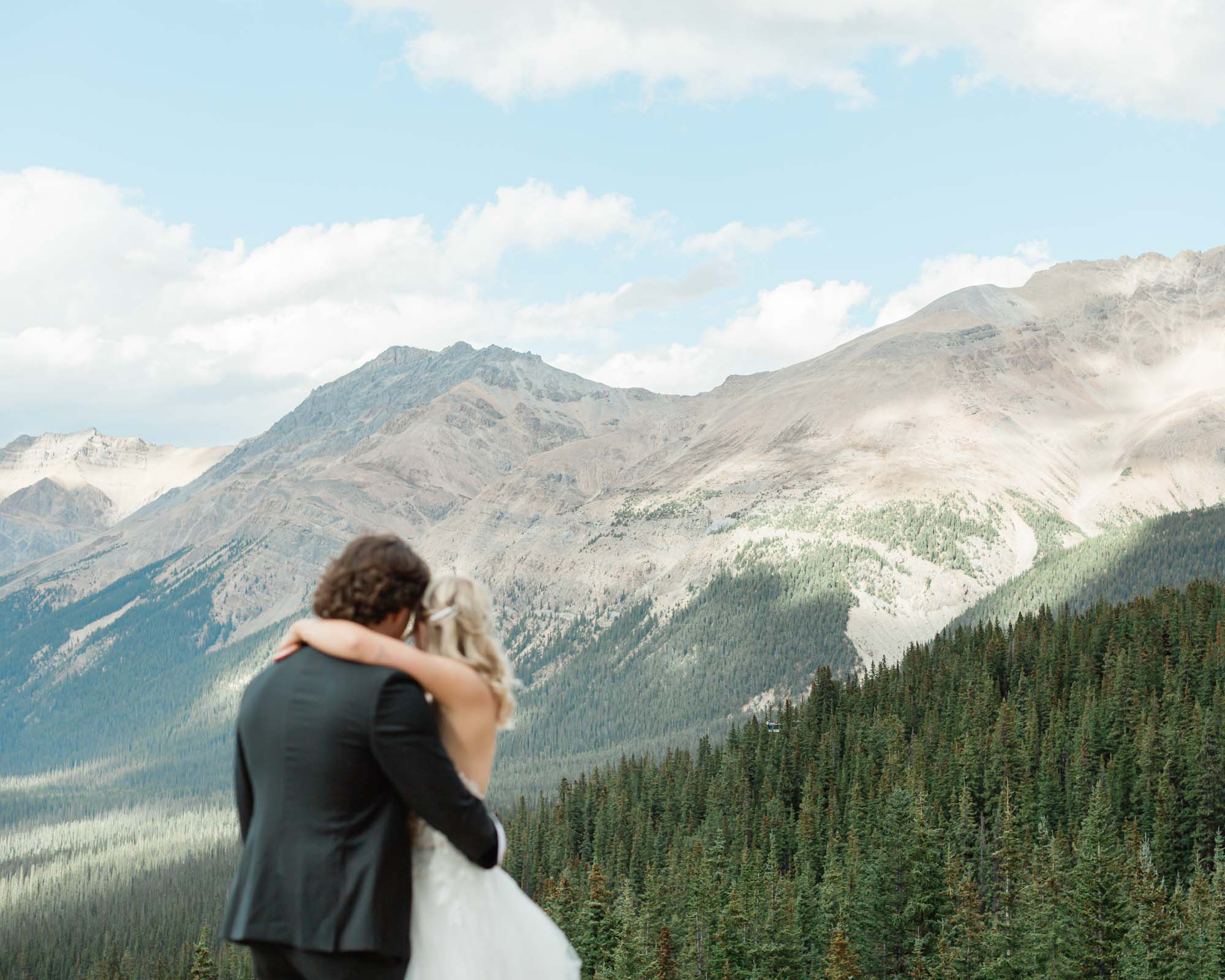 couple embracing after their summer banff wedding 