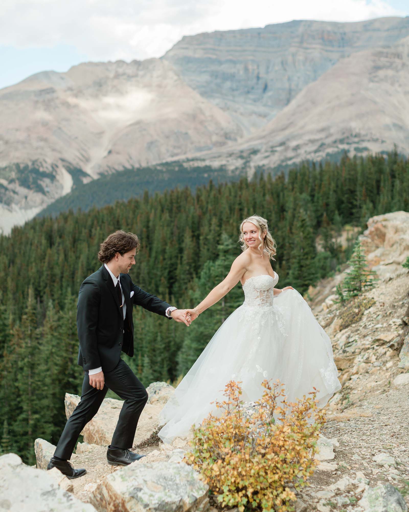 sarah leading tyler after their summer banff wedding 
