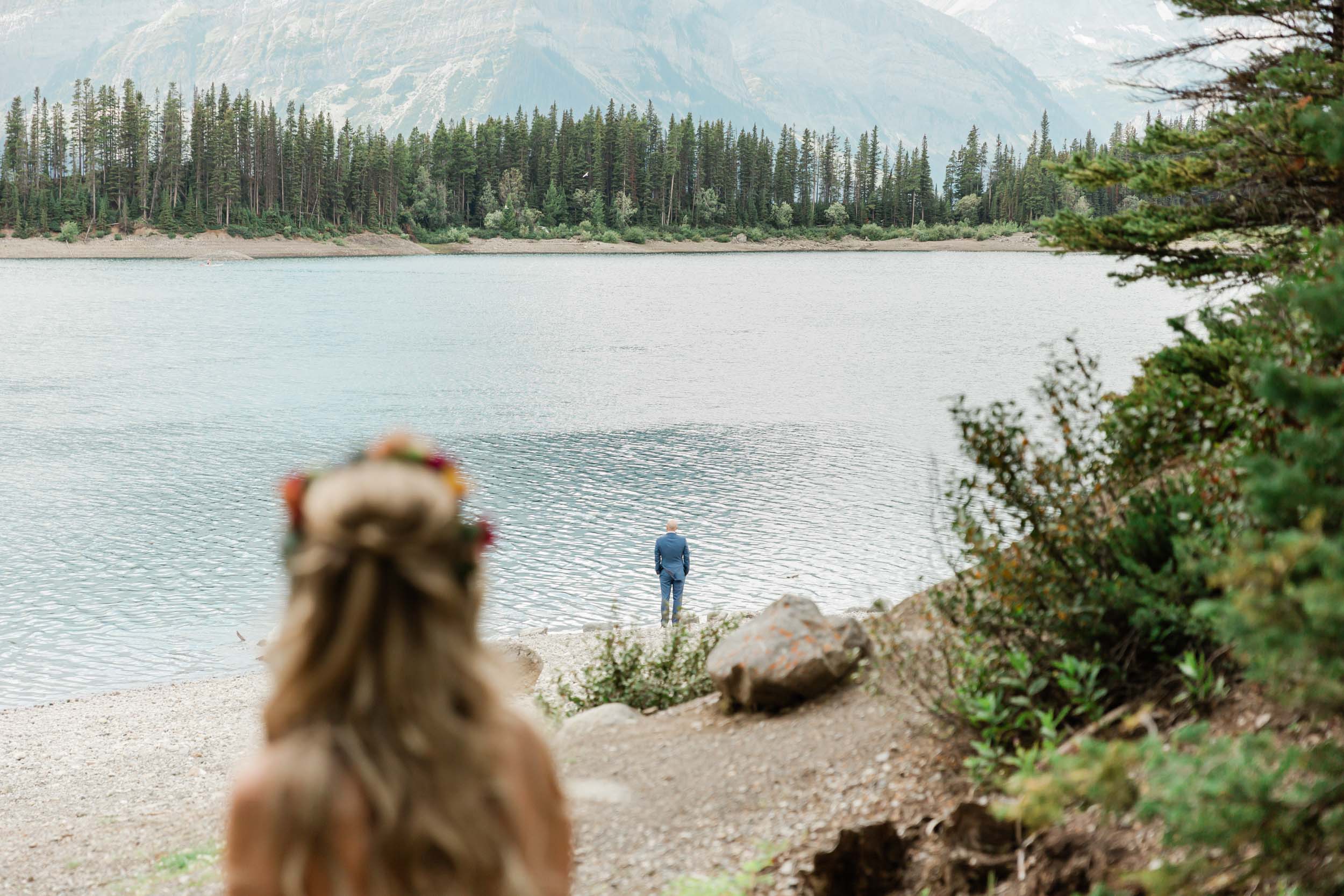 megan preparing for the first look before their kananaskis mountain elopement ceremony 