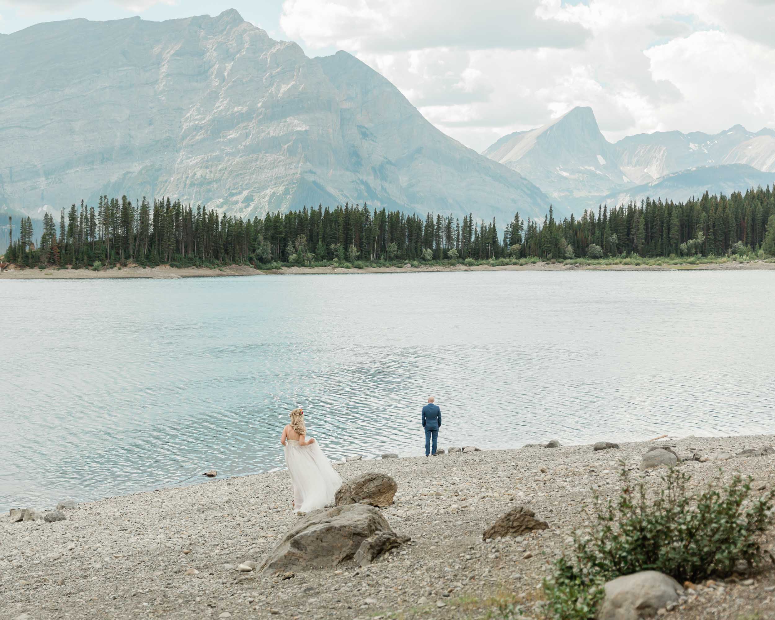 megan preparing for the first look before their kananaskis mountain elopement ceremony 