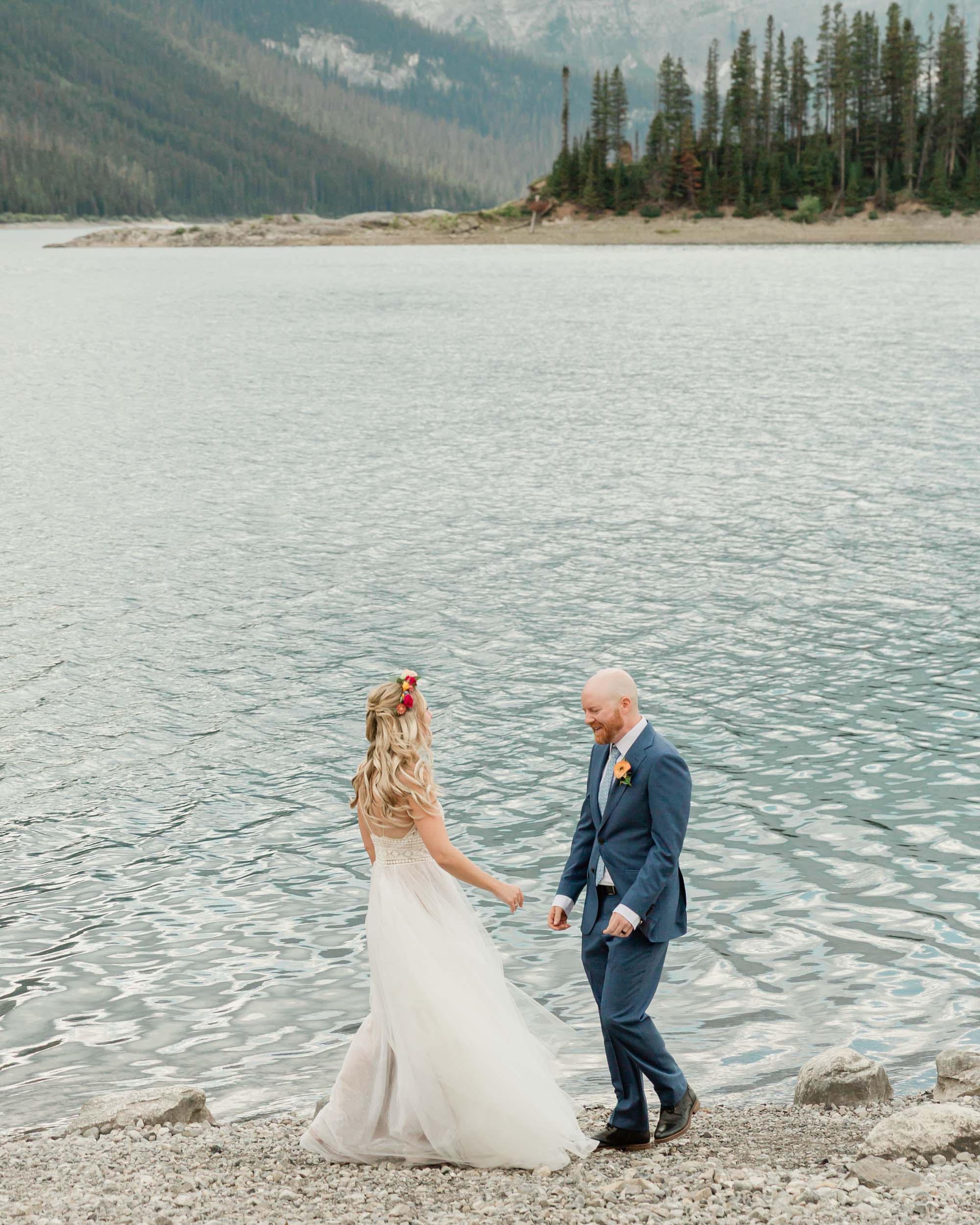 megan preparing for the first look before their kananaskis mountain elopement ceremony 