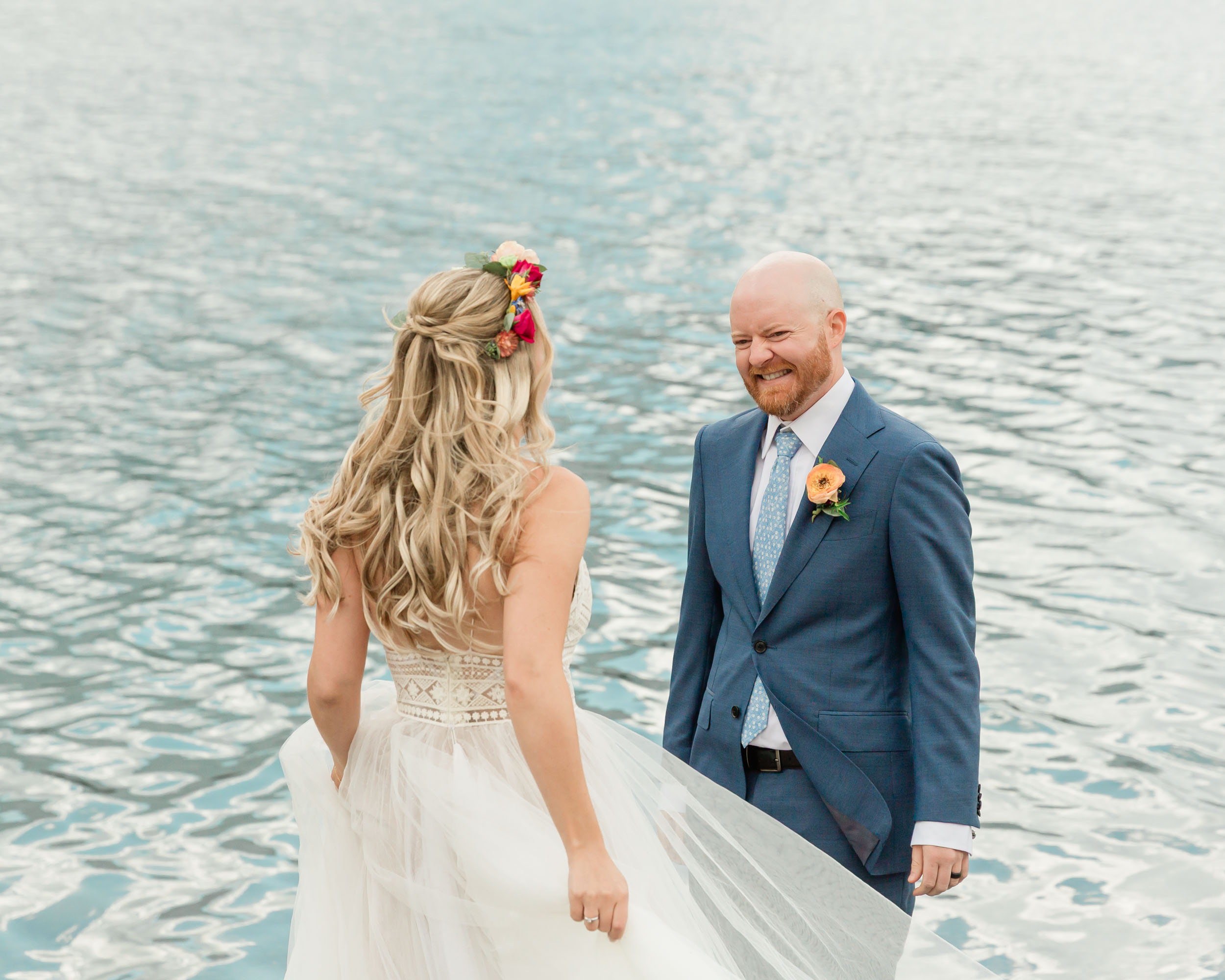scott turning around and seeing megan for the first time on their banff wedding day