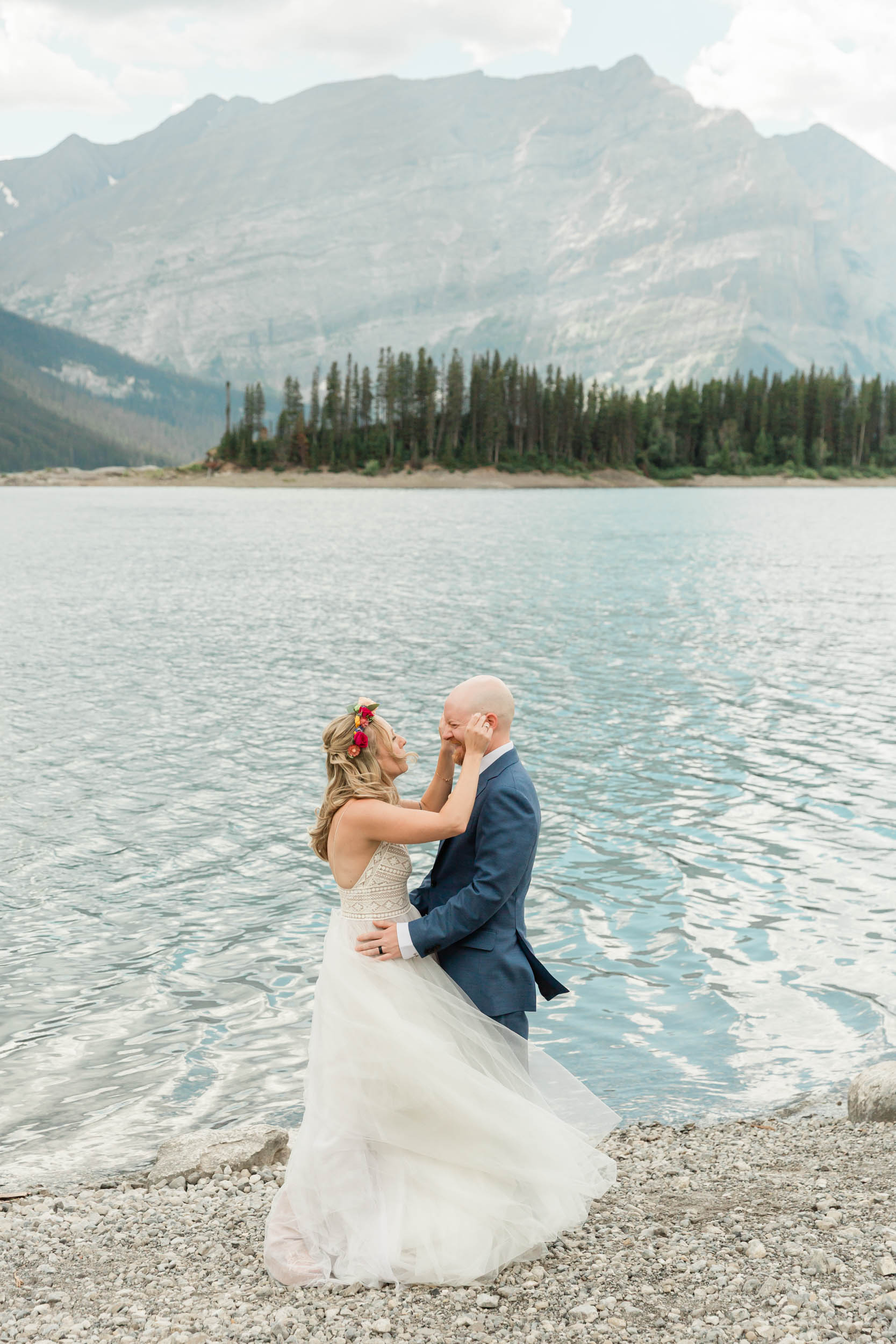 scott turning around and seeing megan for the first time on their banff wedding day