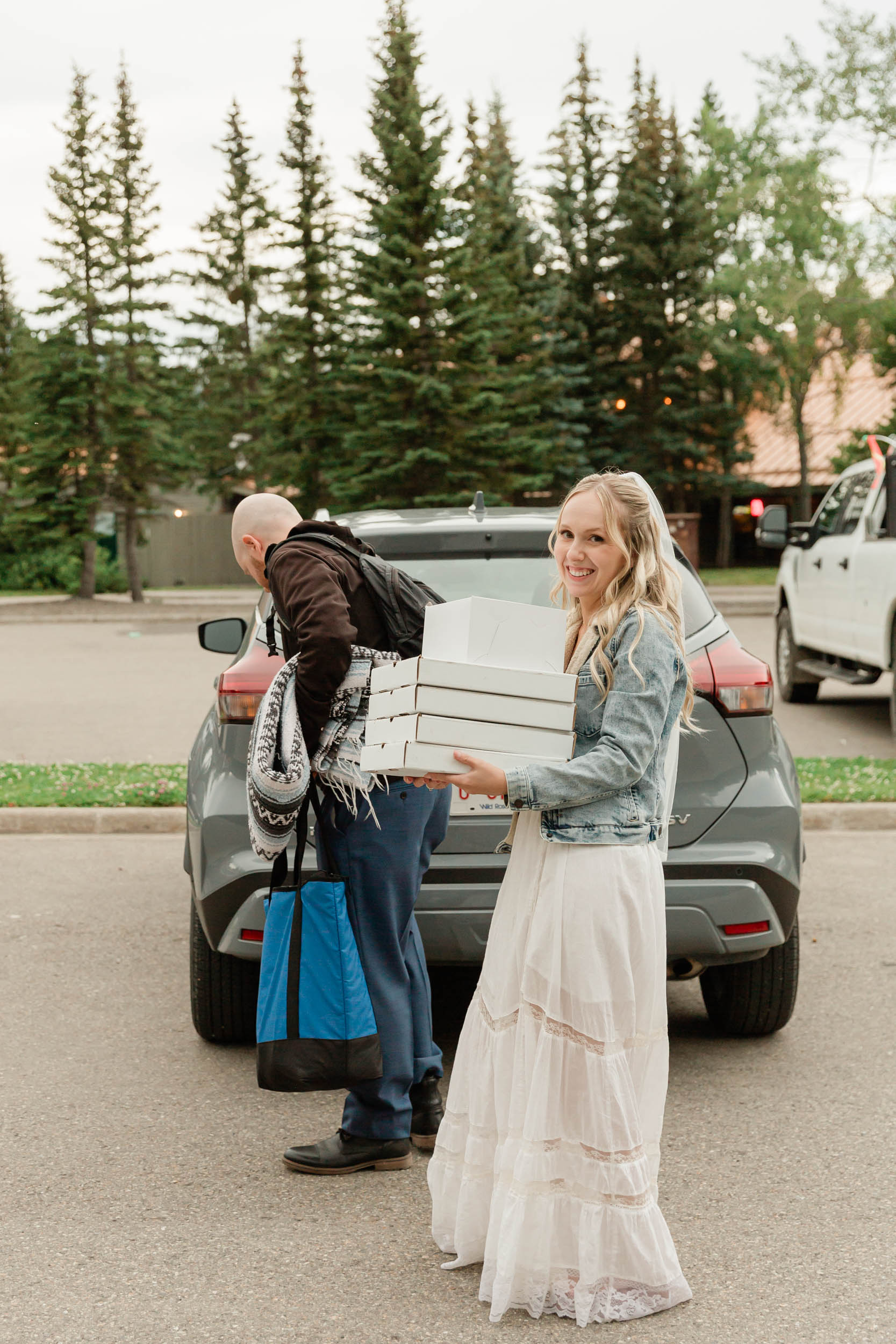getting pizza for their mountain wedding near banff