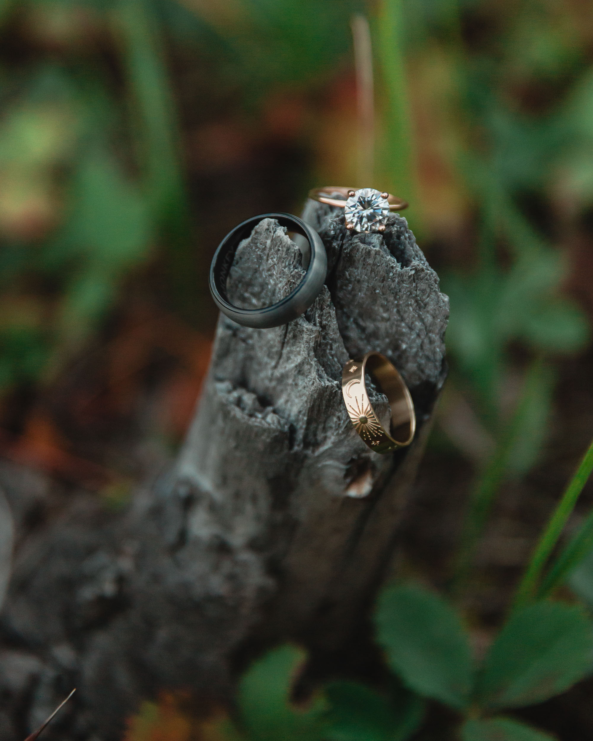close up of the wedding rings and engagement ring