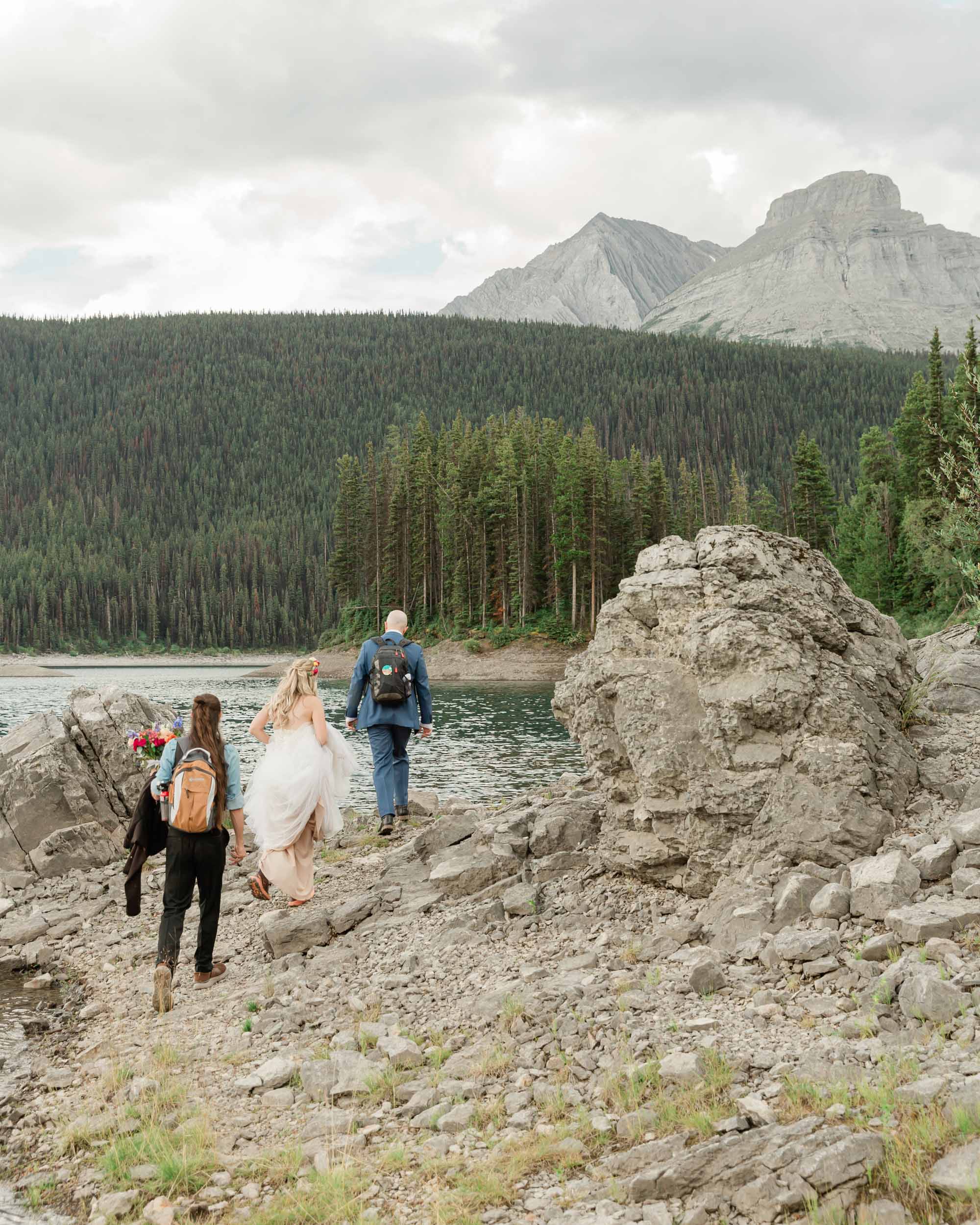 walking towards their ceremony for the couple's kananaskis mountain elopement 