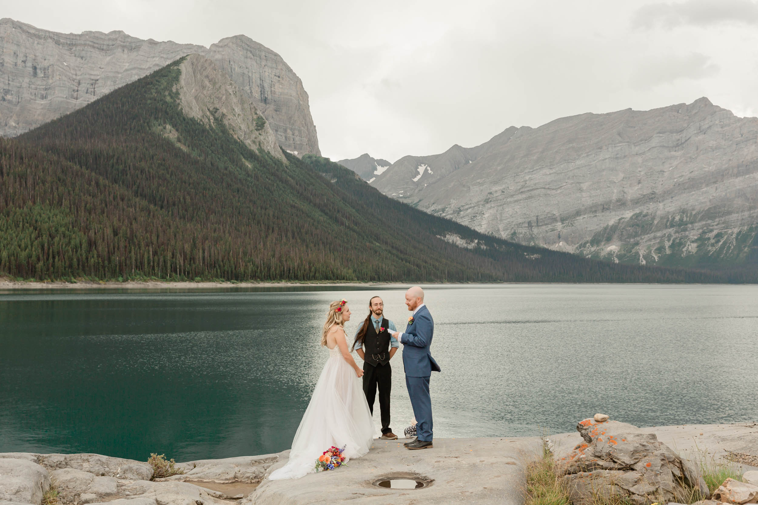 the couple reciting their vows for their kananaskis mountain elopement