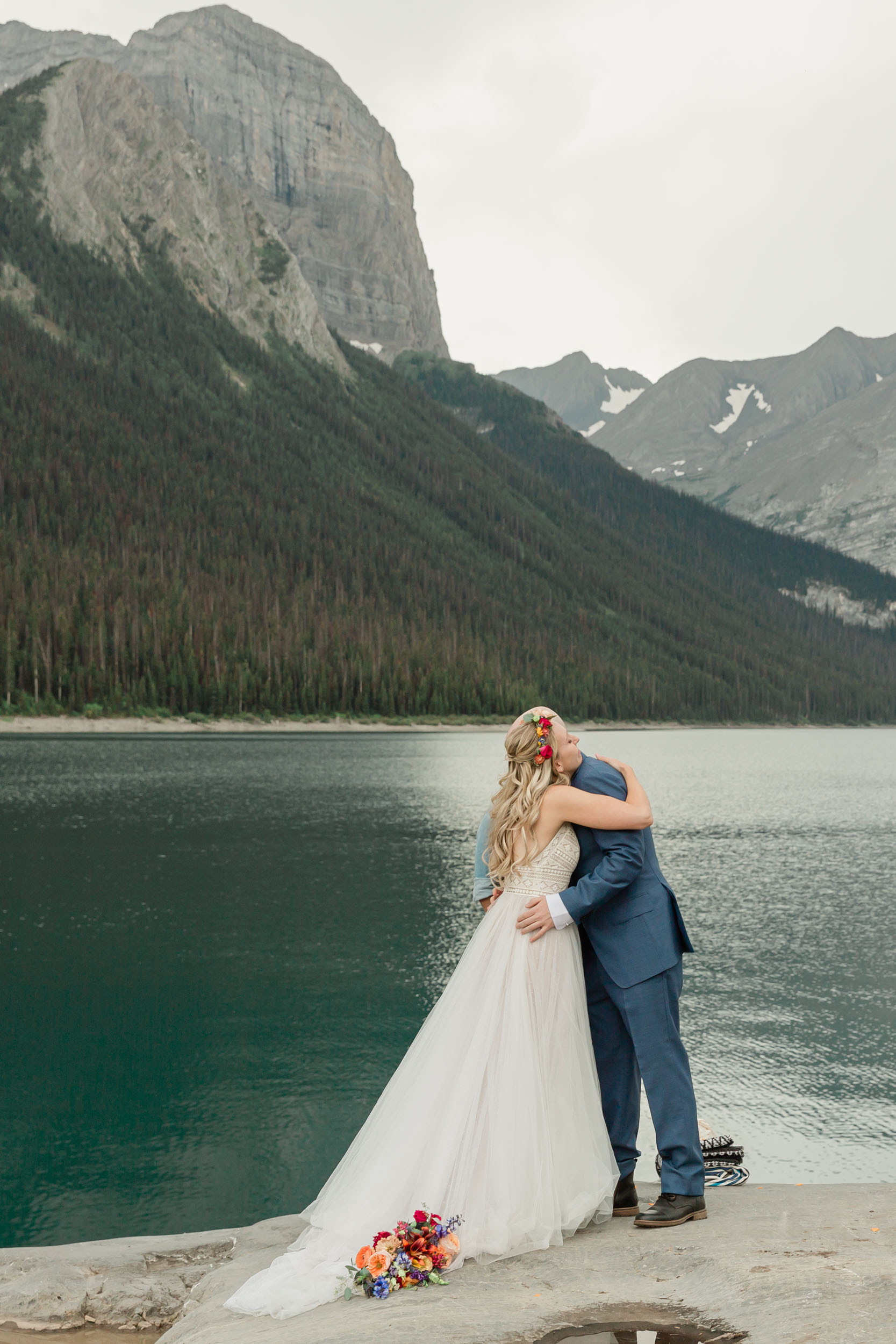 the couple reciting their vows and exchanging rings for their kananaskis mountain elopement ceremony