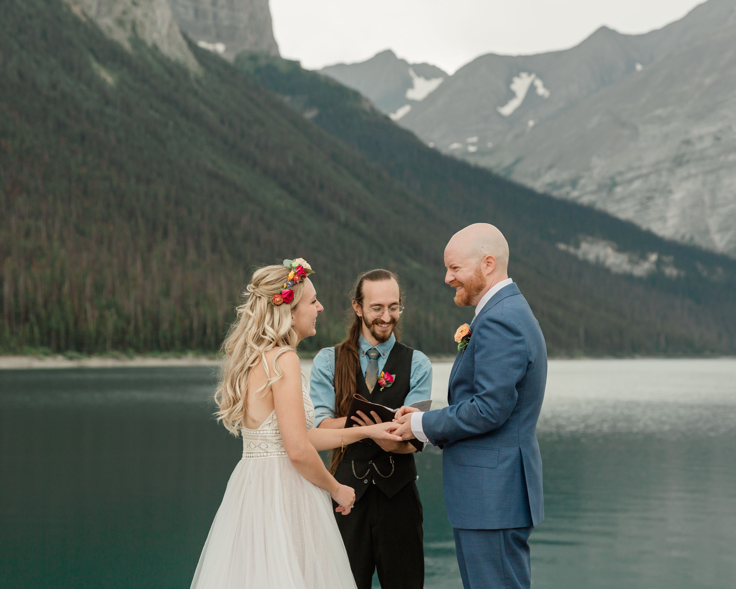 the couple reciting their vows and exchanging rings for their kananaskis mountain elopement ceremony
