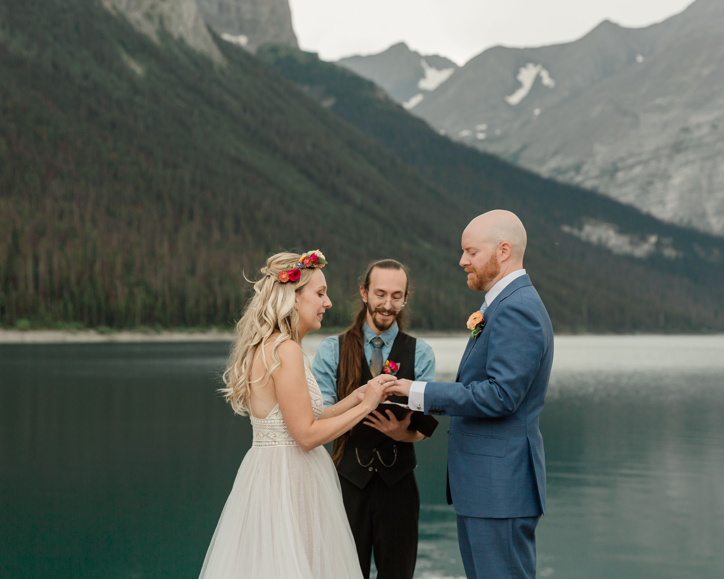 the couple reciting their vows and exchanging rings for their kananaskis mountain elopement ceremony