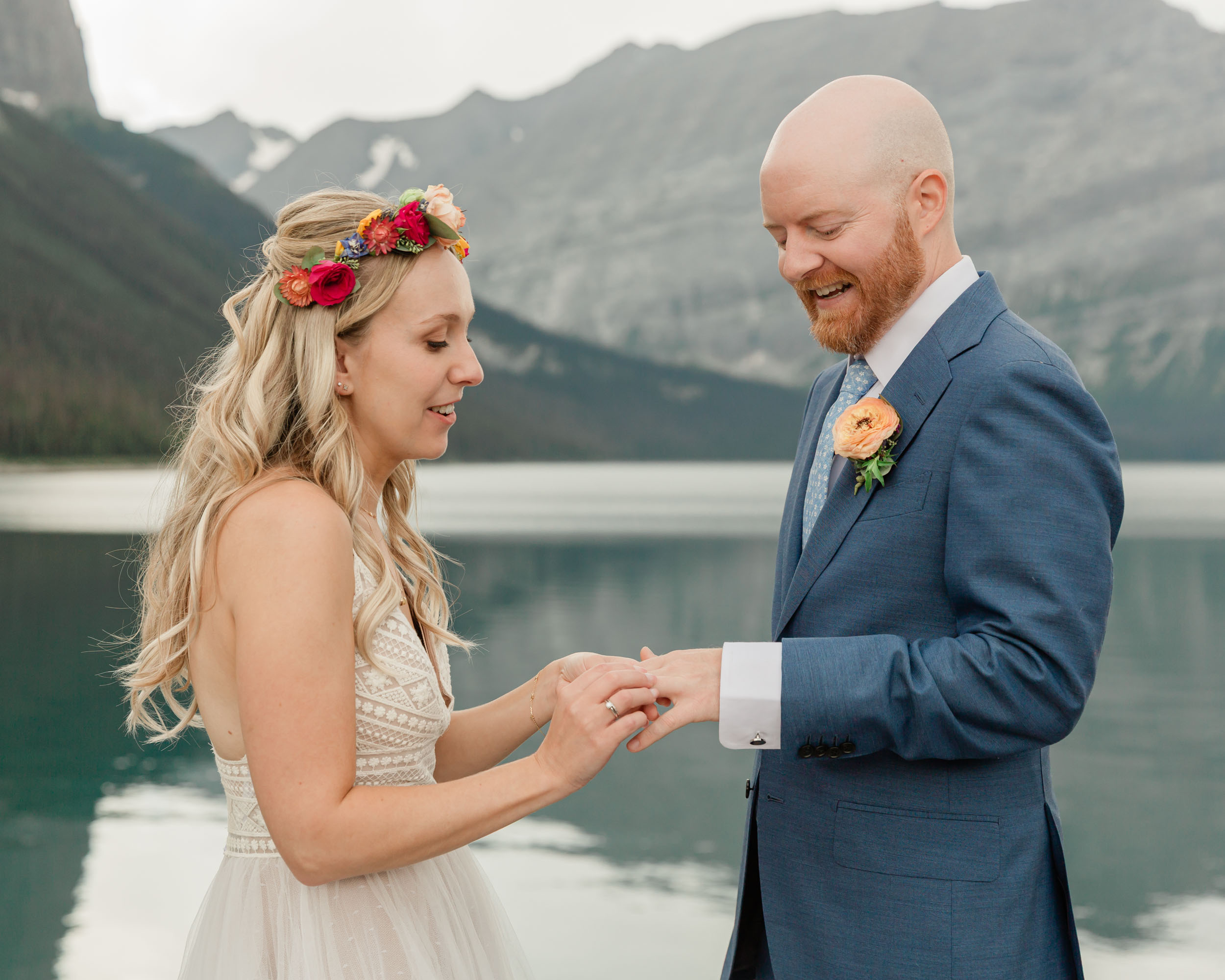 the couple reciting their vows and exchanging rings for their kananaskis mountain elopement ceremony