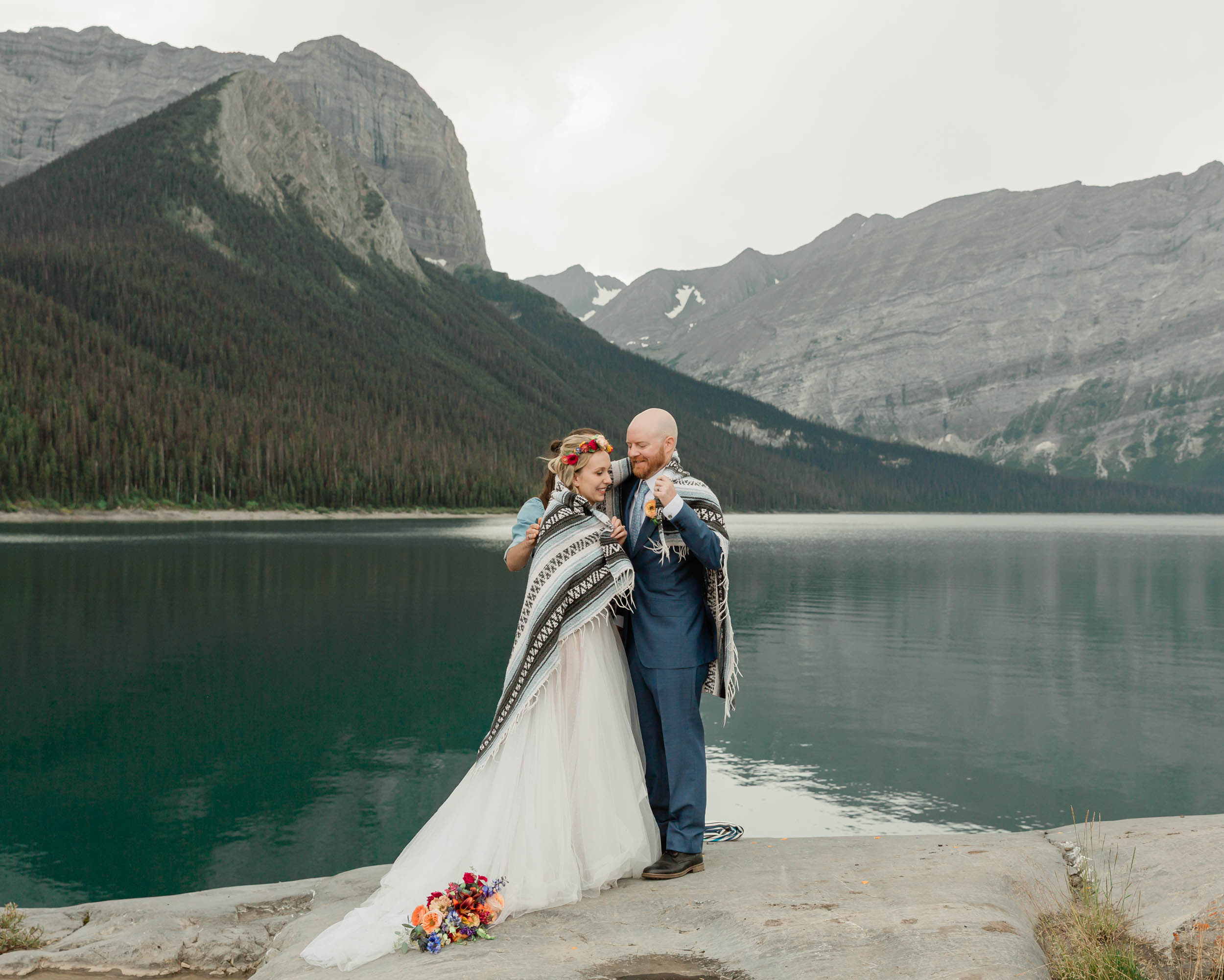 the embracing during the blanket wedding ritual for their kananaskis mountain elopement ceremony
