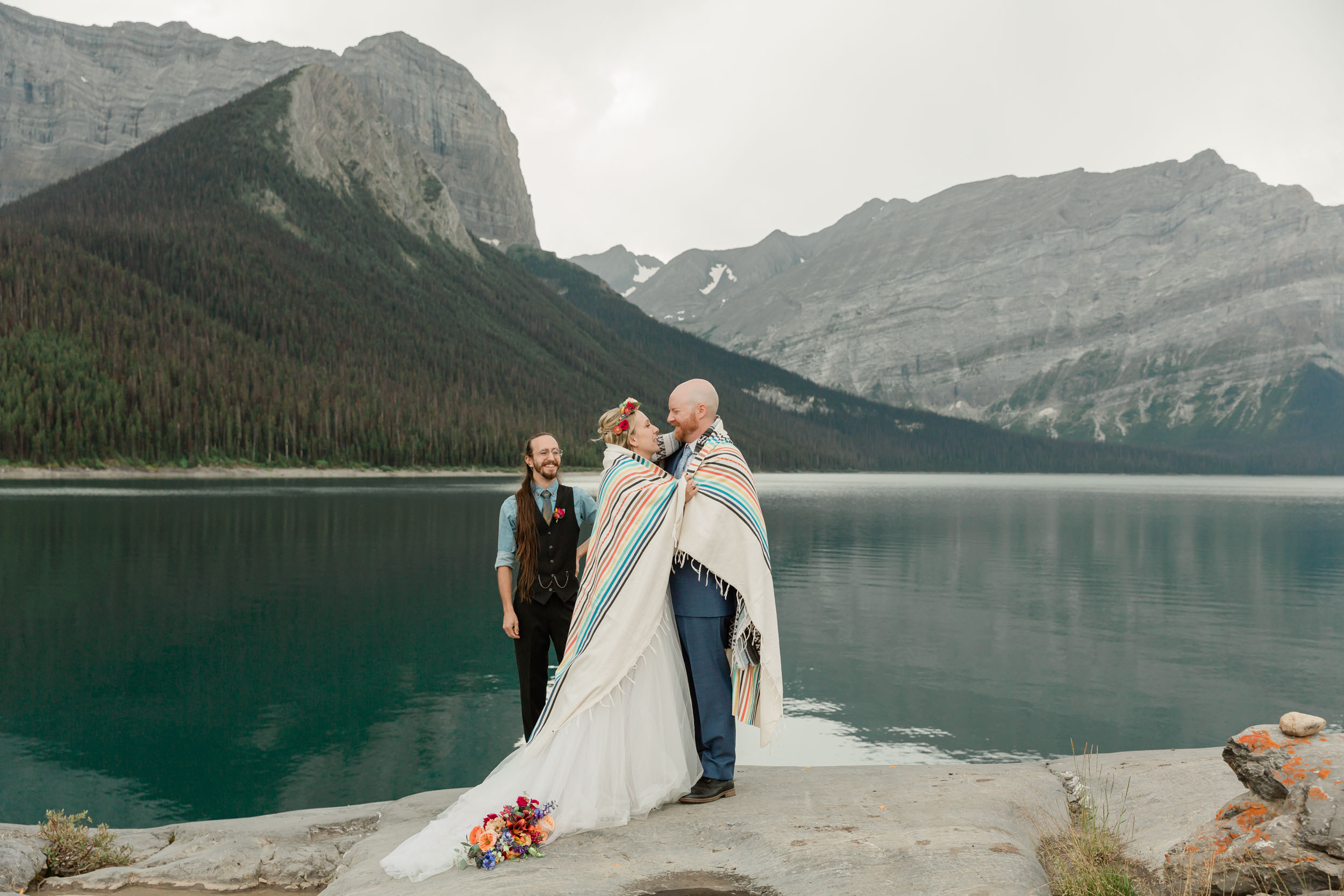 the embracing during the blanket wedding ritual for their kananaskis mountain elopement ceremony