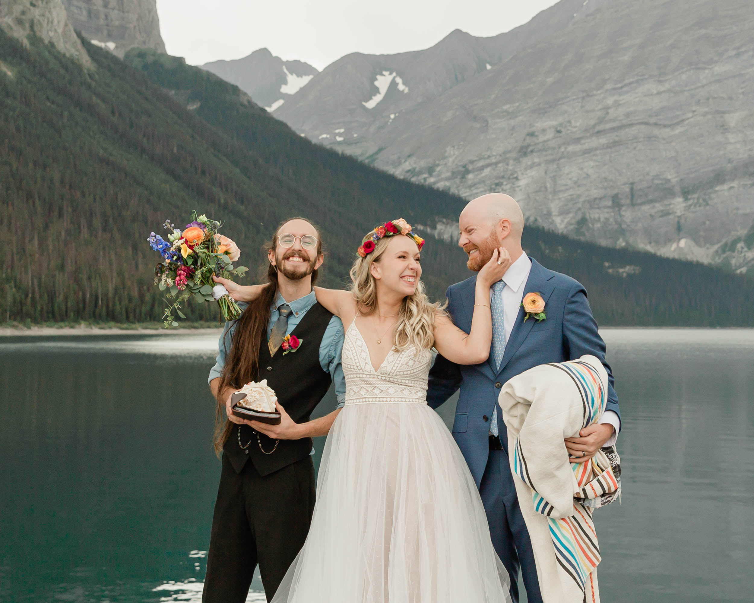 the embracing during the blanket wedding ritual for their kananaskis mountain elopement ceremony
