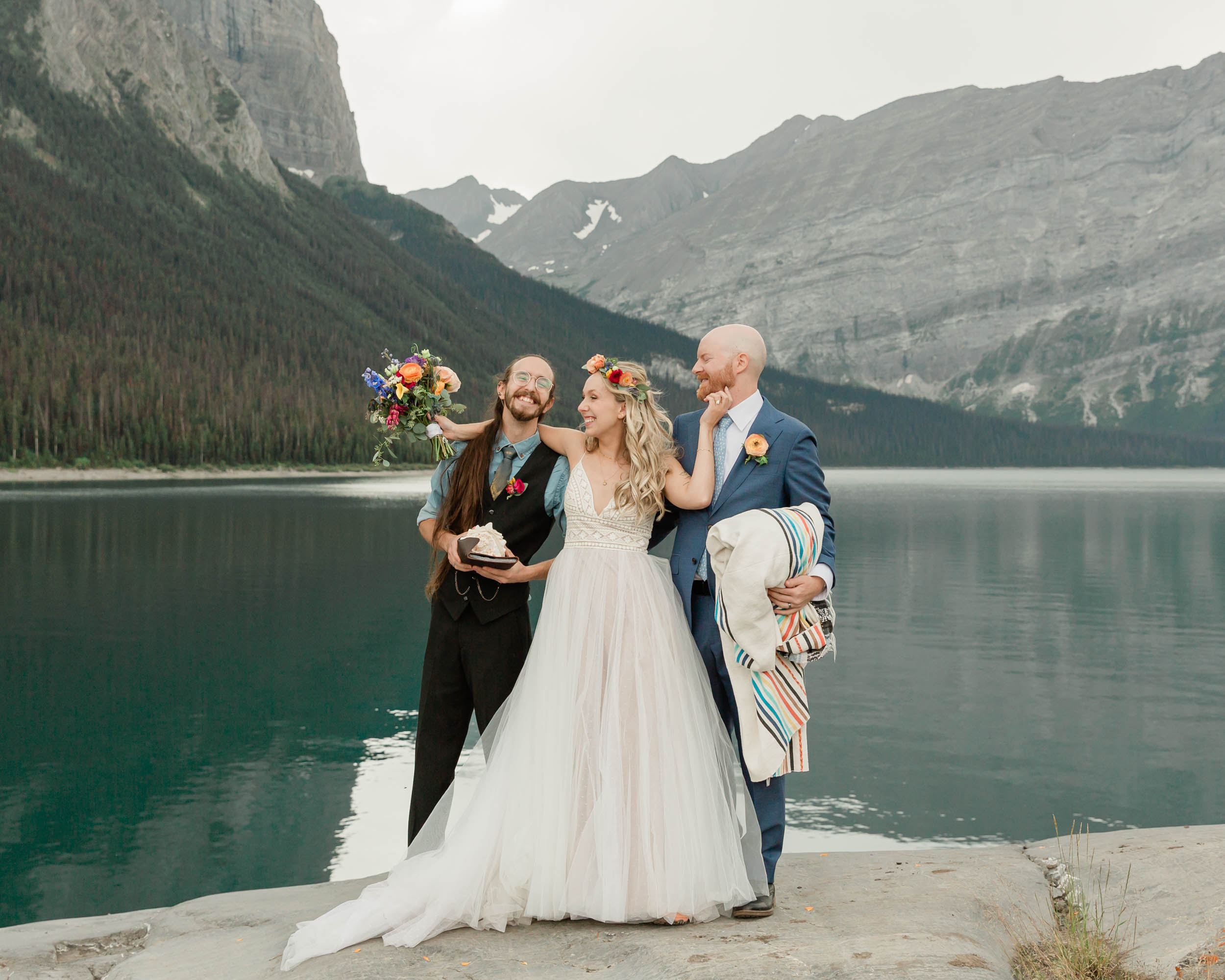 the embracing during the blanket wedding ritual for their kananaskis mountain elopement ceremony