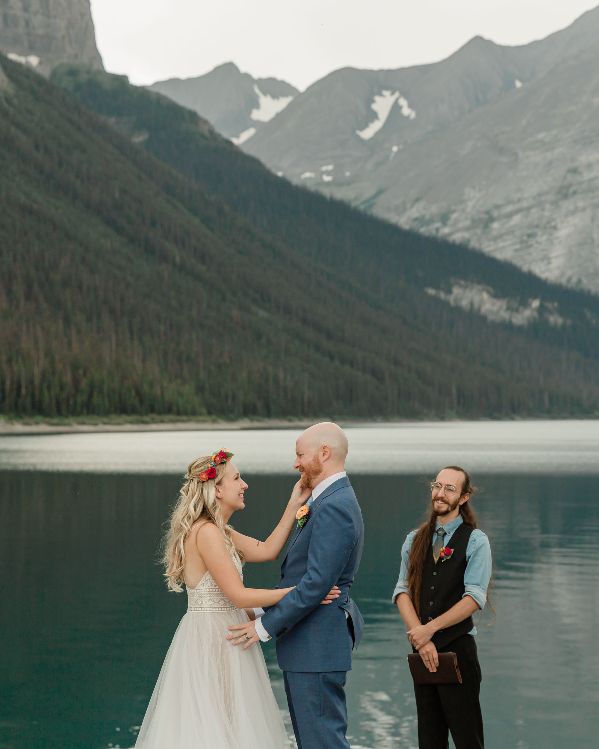 the couple reciting their vows and exchanging rings for their kananaskis mountain elopement ceremony