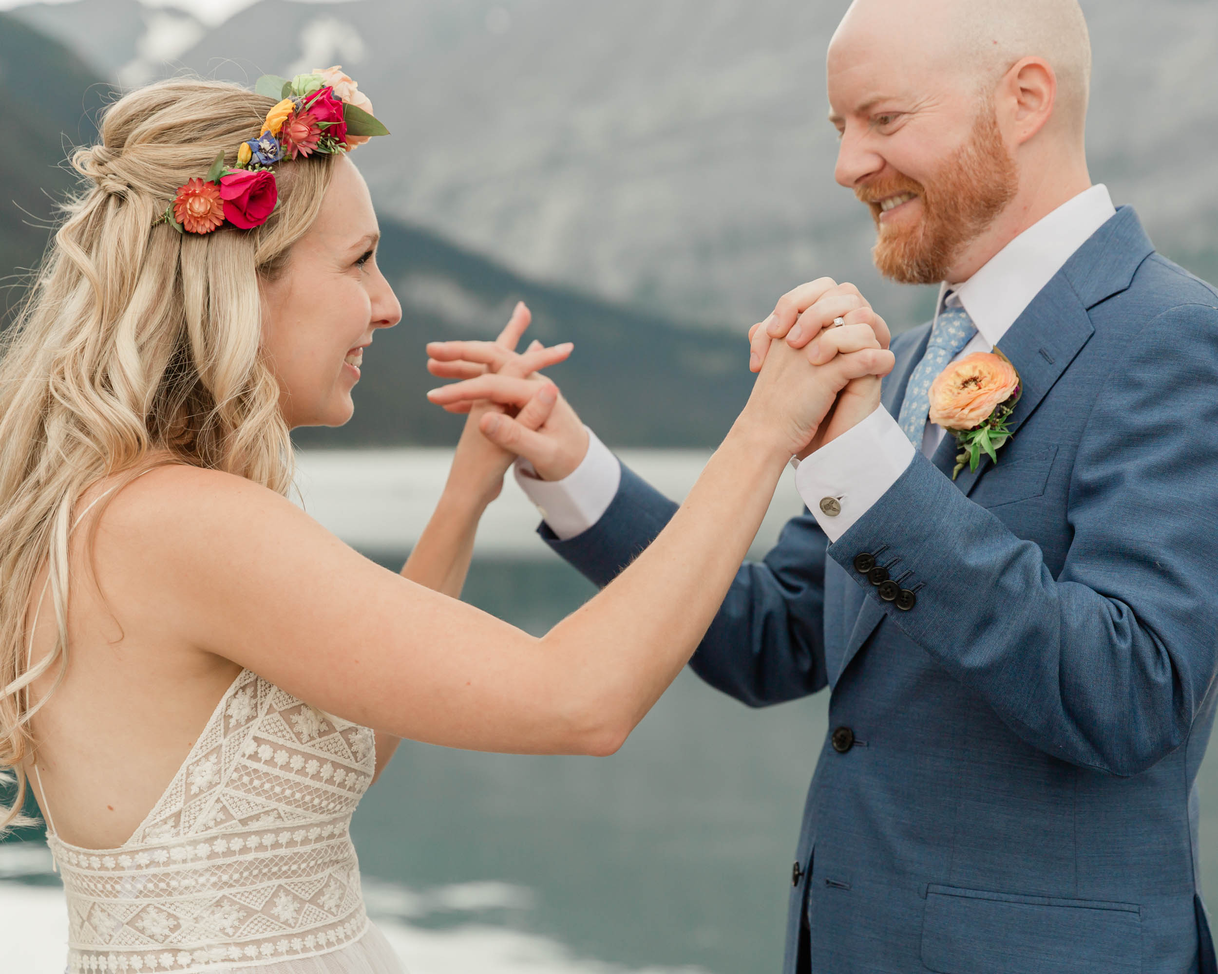 the couple reciting their vows and exchanging rings for their kananaskis mountain elopement ceremony