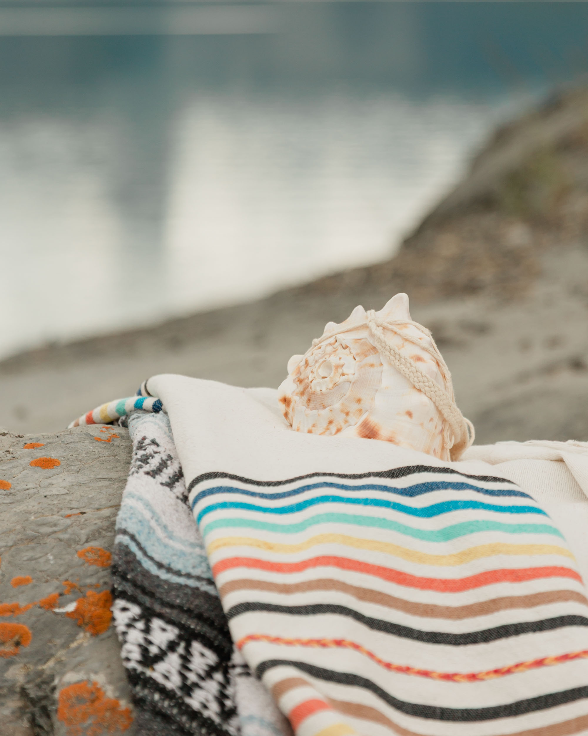 a close up on the conch shell and the blanket from their mountain ceremony