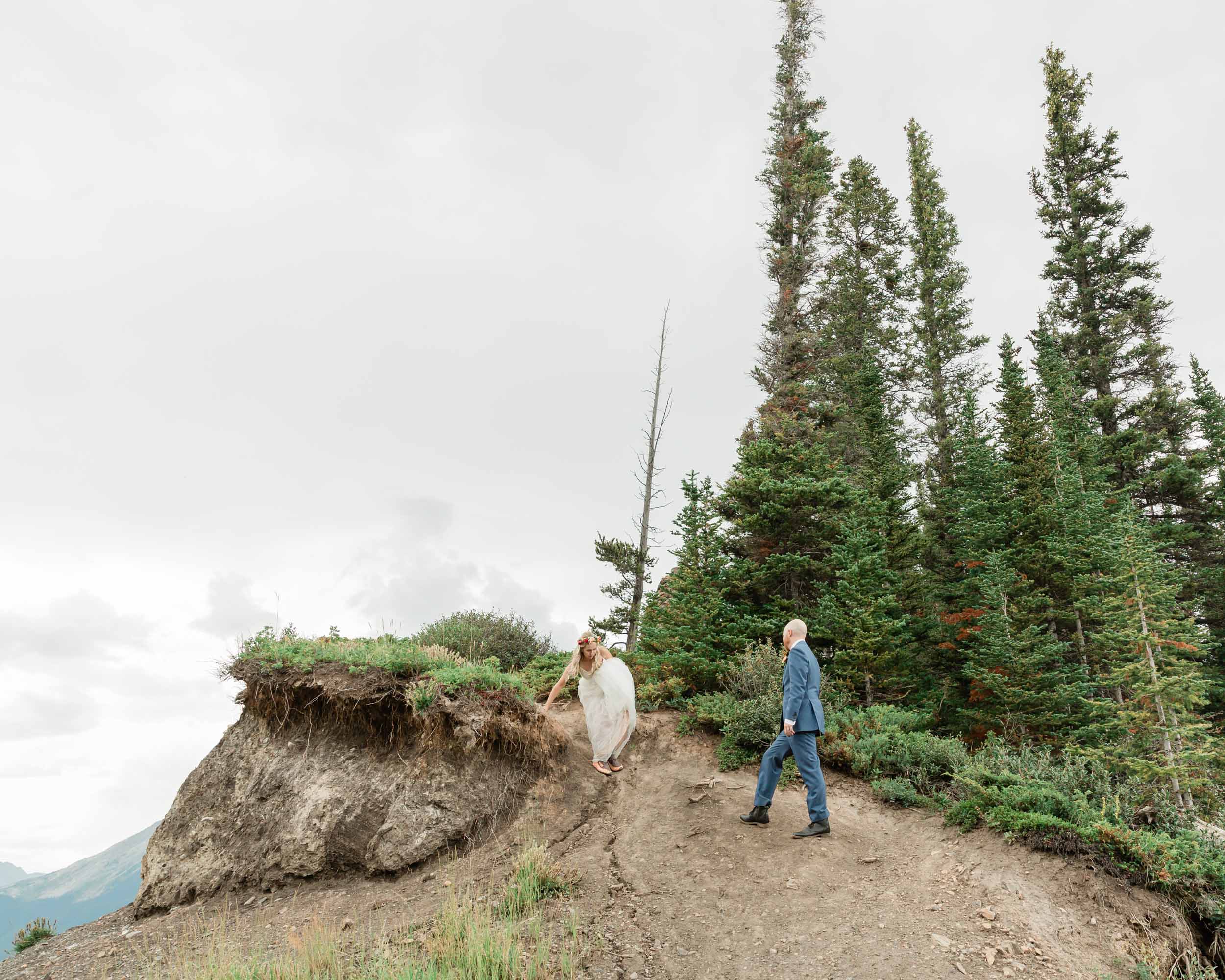 the bride and groom exploring during their kananaskis mountain elopement