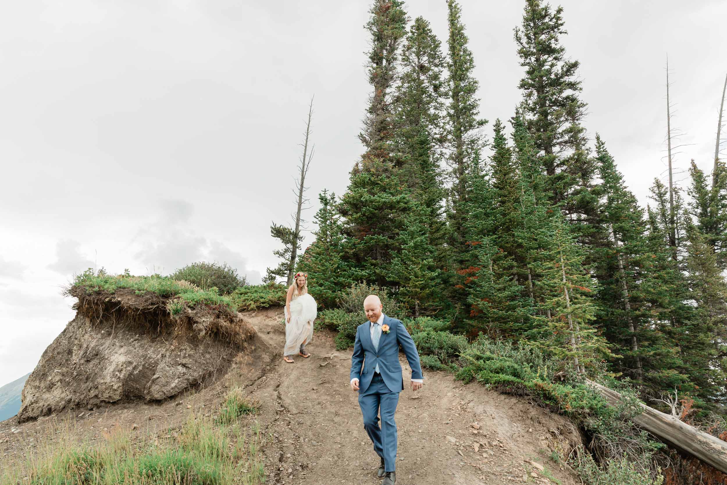 the bride and groom exploring during their kananaskis mountain elopement
