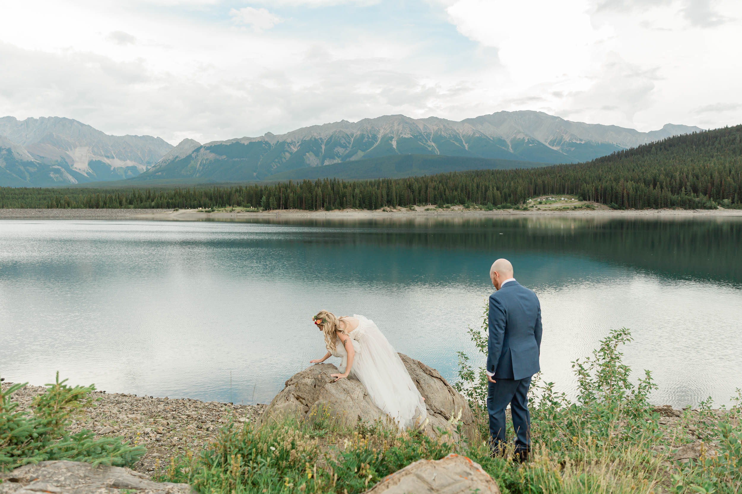 the bride and groom exploring during their kananaskis mountain elopement