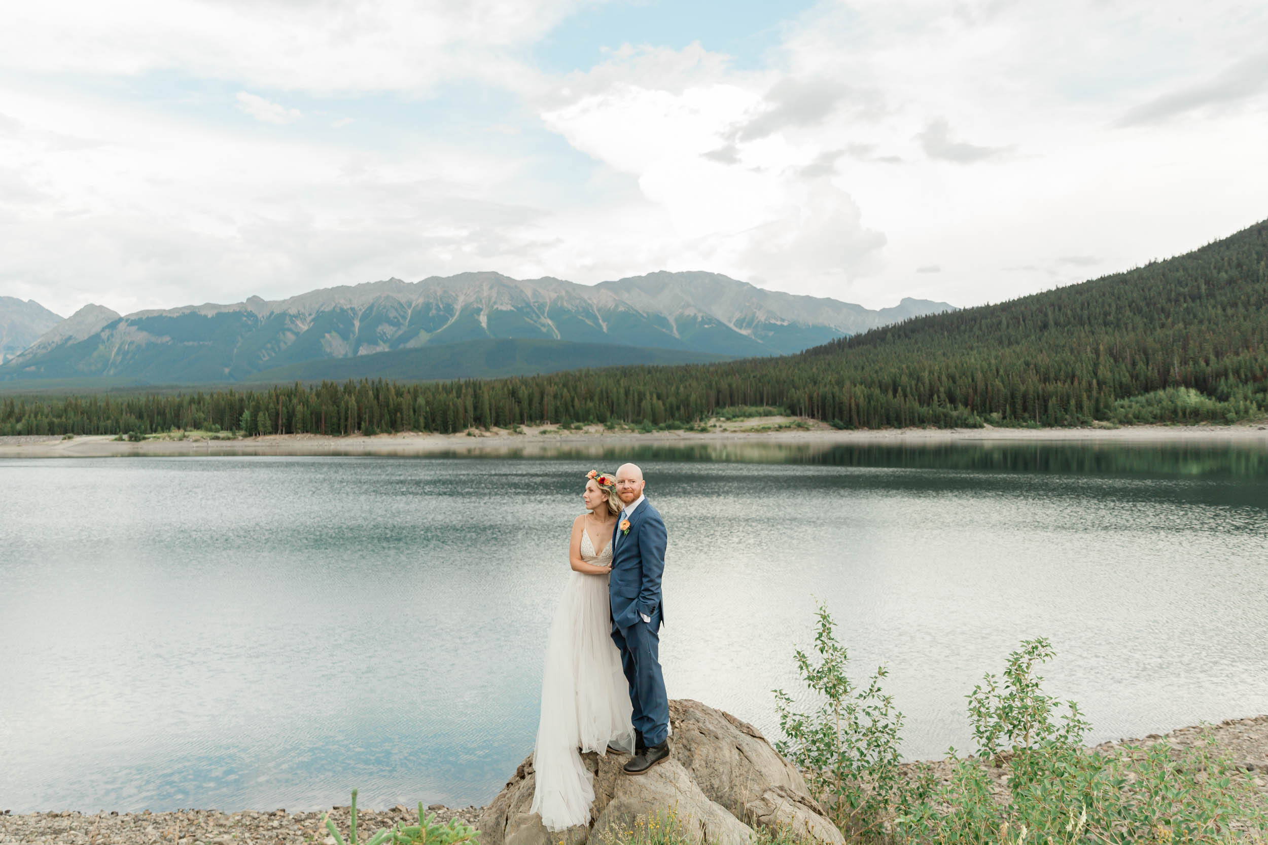 the bride and groom exploring during their kananaskis mountain elopement