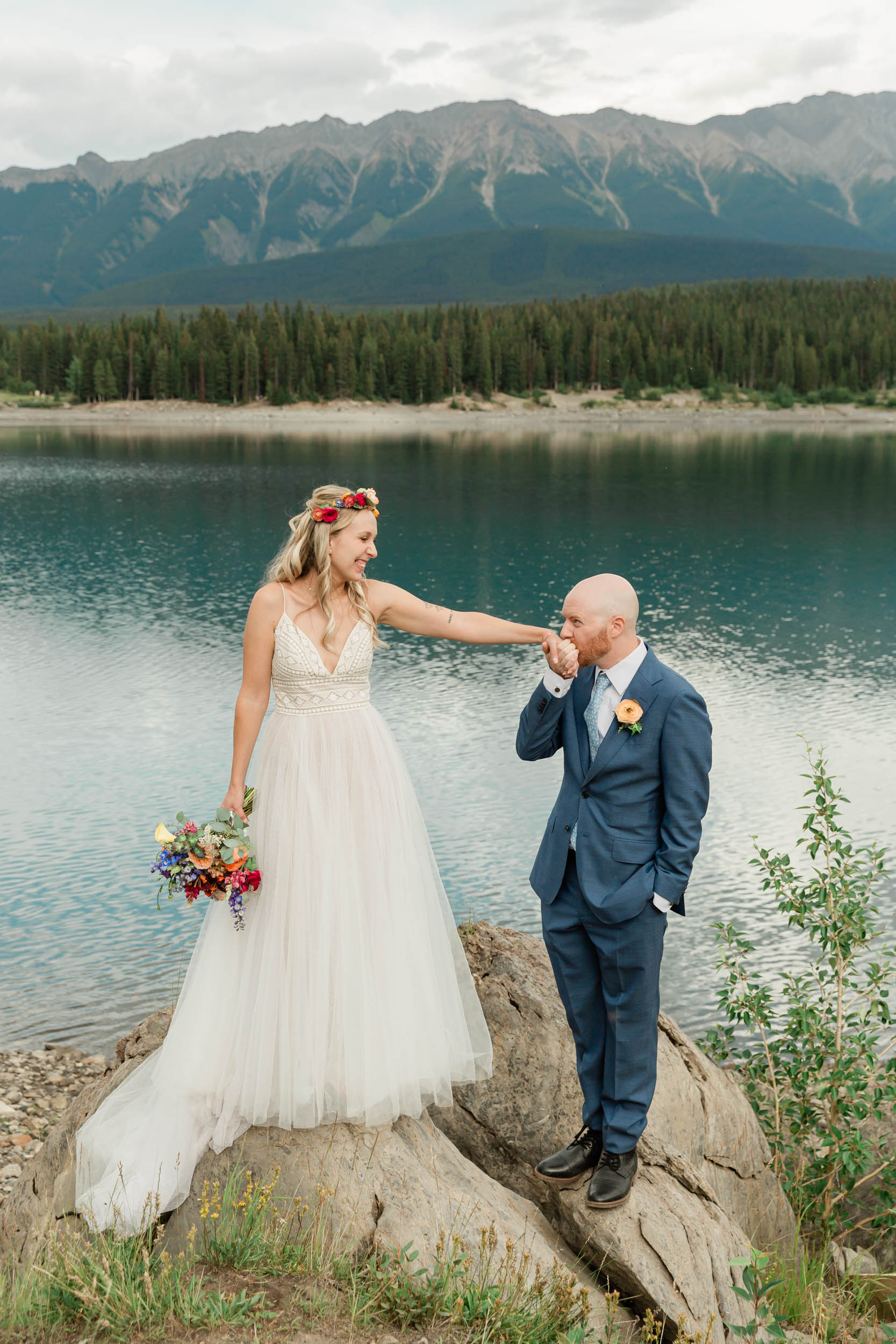 the bride and groom exploring during their kananaskis mountain elopement