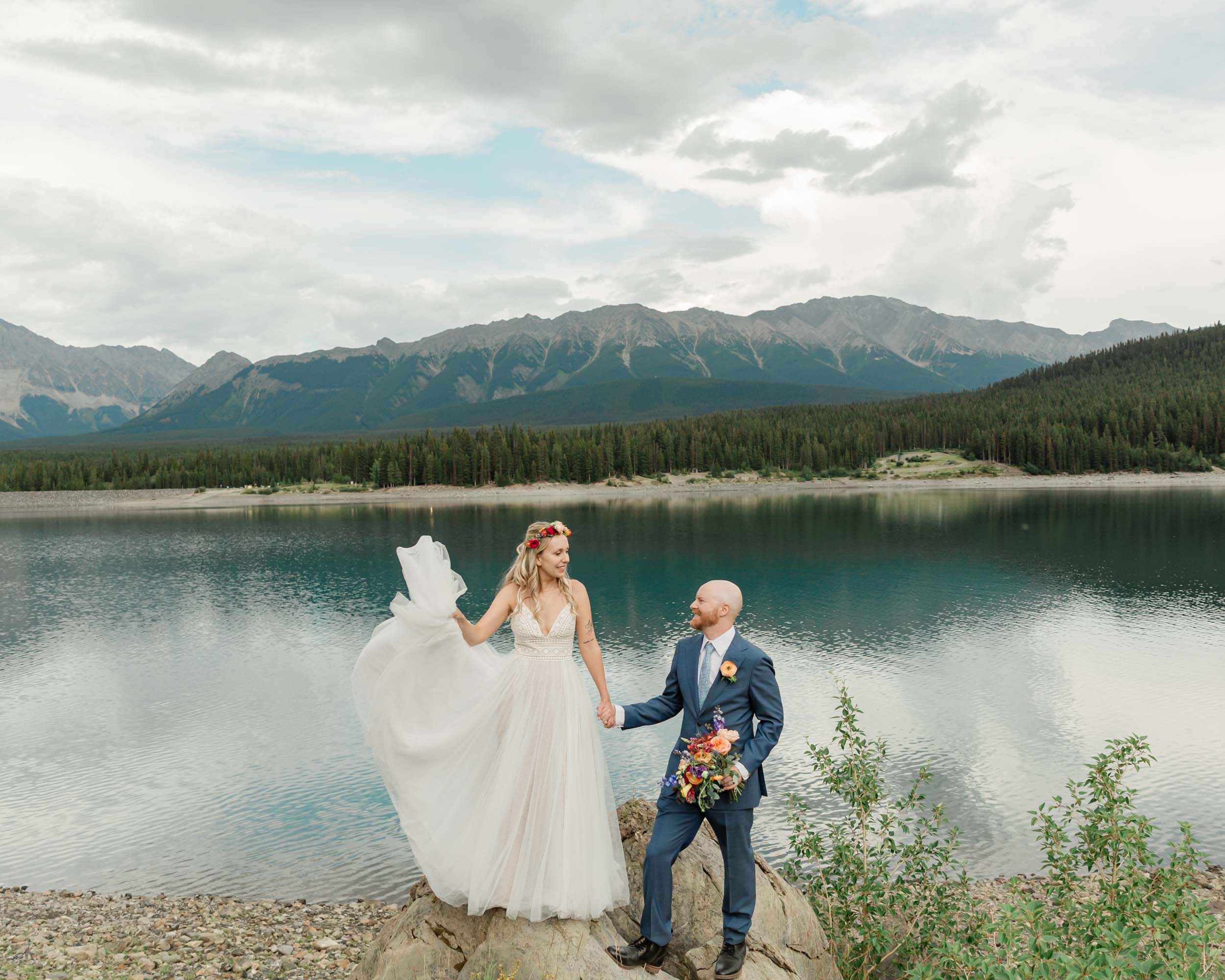 the bride and groom exploring during their kananaskis mountain elopement