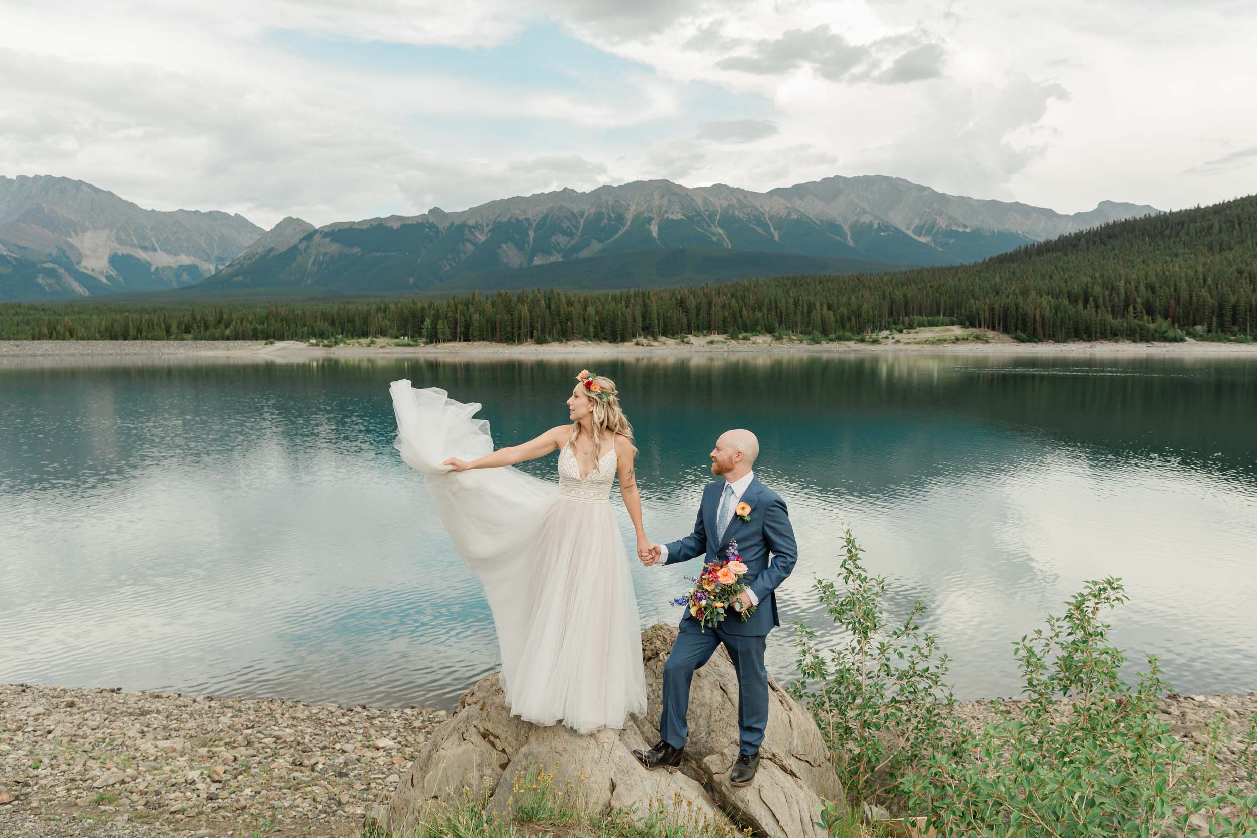 the bride and groom exploring during their kananaskis mountain elopement