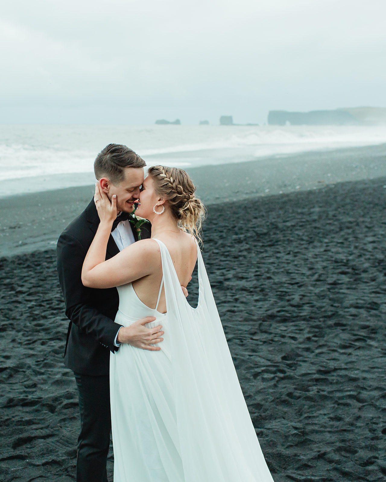 See Michael & Nicole's Iceland beach elopement on Iceland's South Coast, with waterfalls, black sand beaches, and planning inspiration.